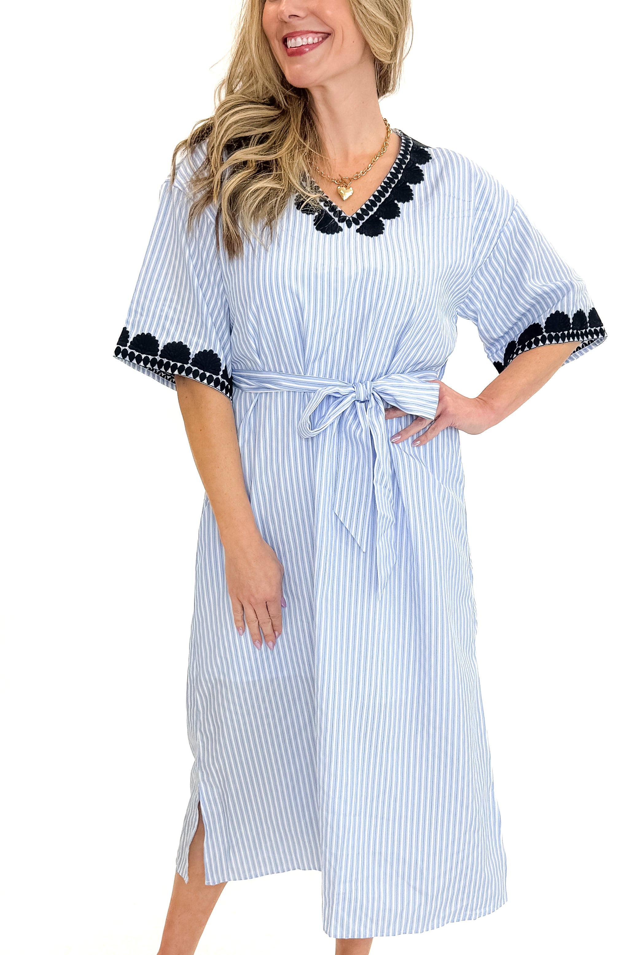 Front view of woman wearing Blue Striped Embroidery Accent Midi Dress with sandals against white studio background.
