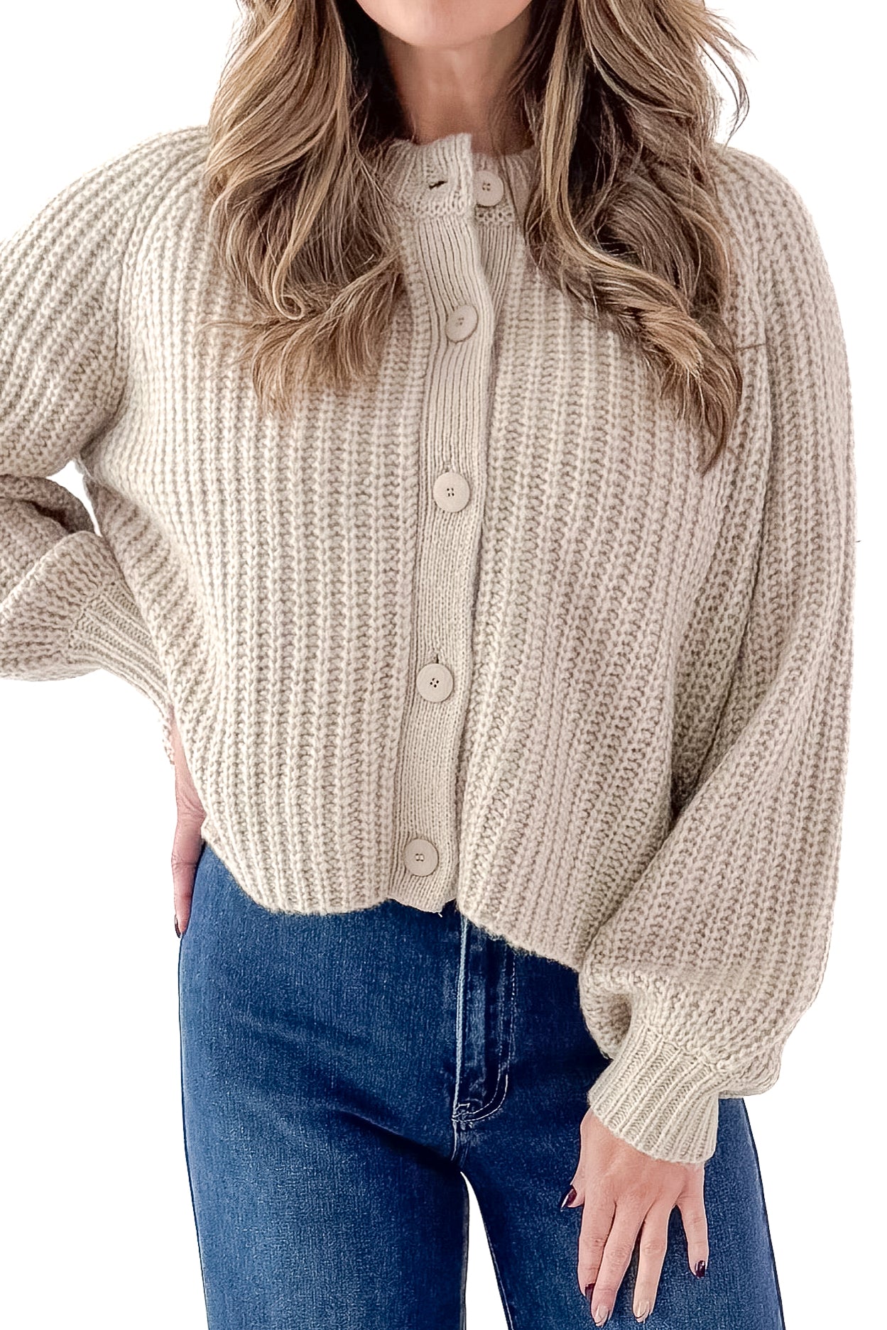 Front detailed view of woman wearing Light Mocha Button Up Cardigan with jeans against white studio background.