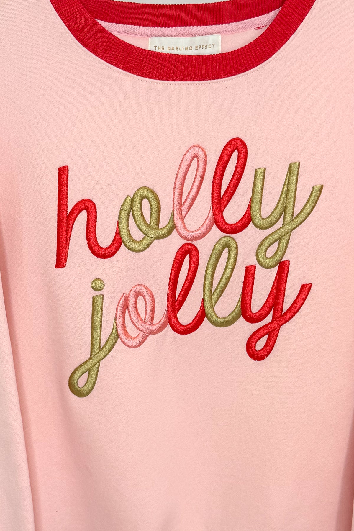 Swagger Boutique’s Holly Jolly Signature Crew Sweatshirt against white studio background.