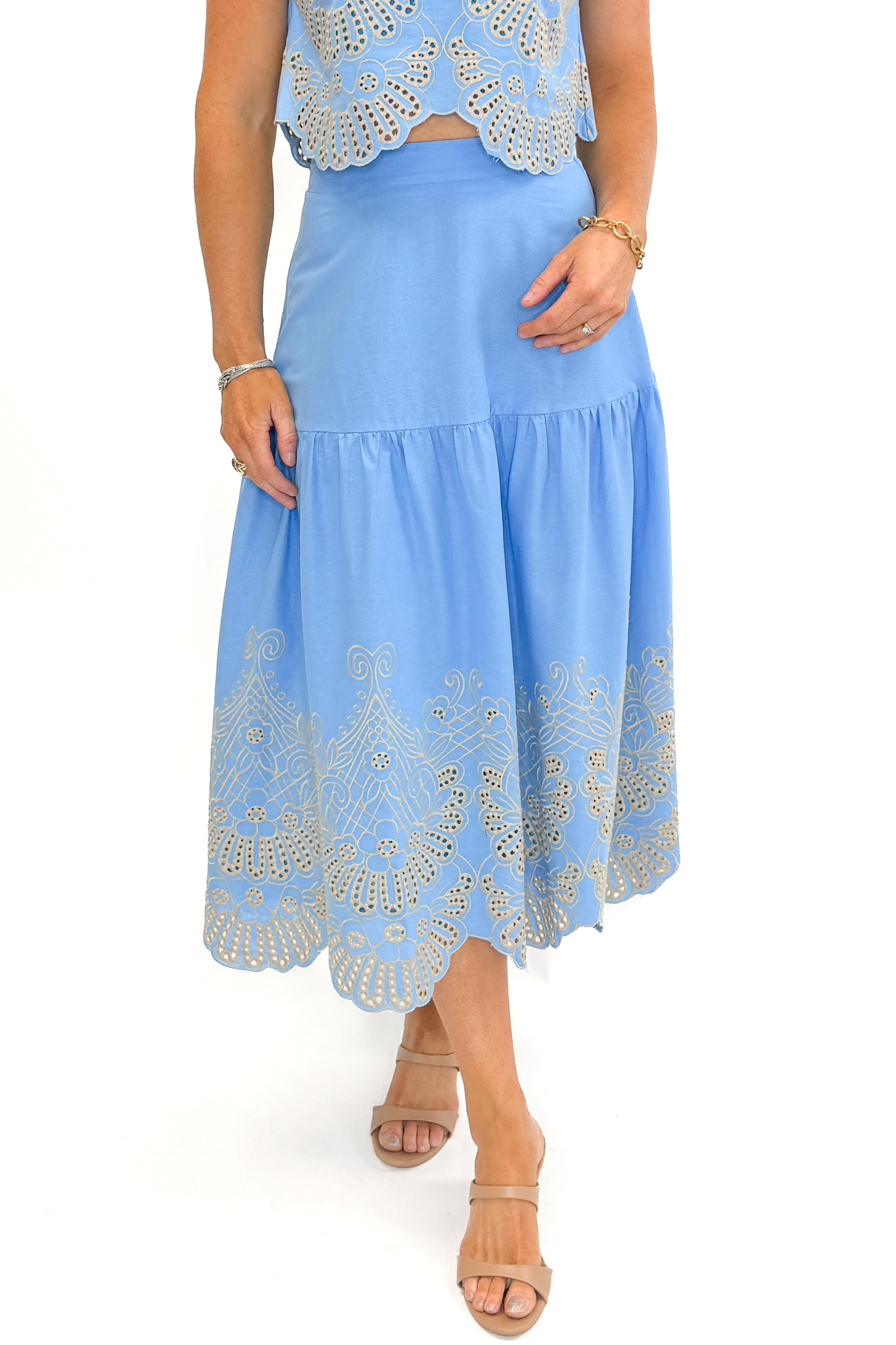 Front detail view of woman wearing Light Blue Eyelet Detail Tank with Light Blue Eyelet Detail Skirt against white studio background.