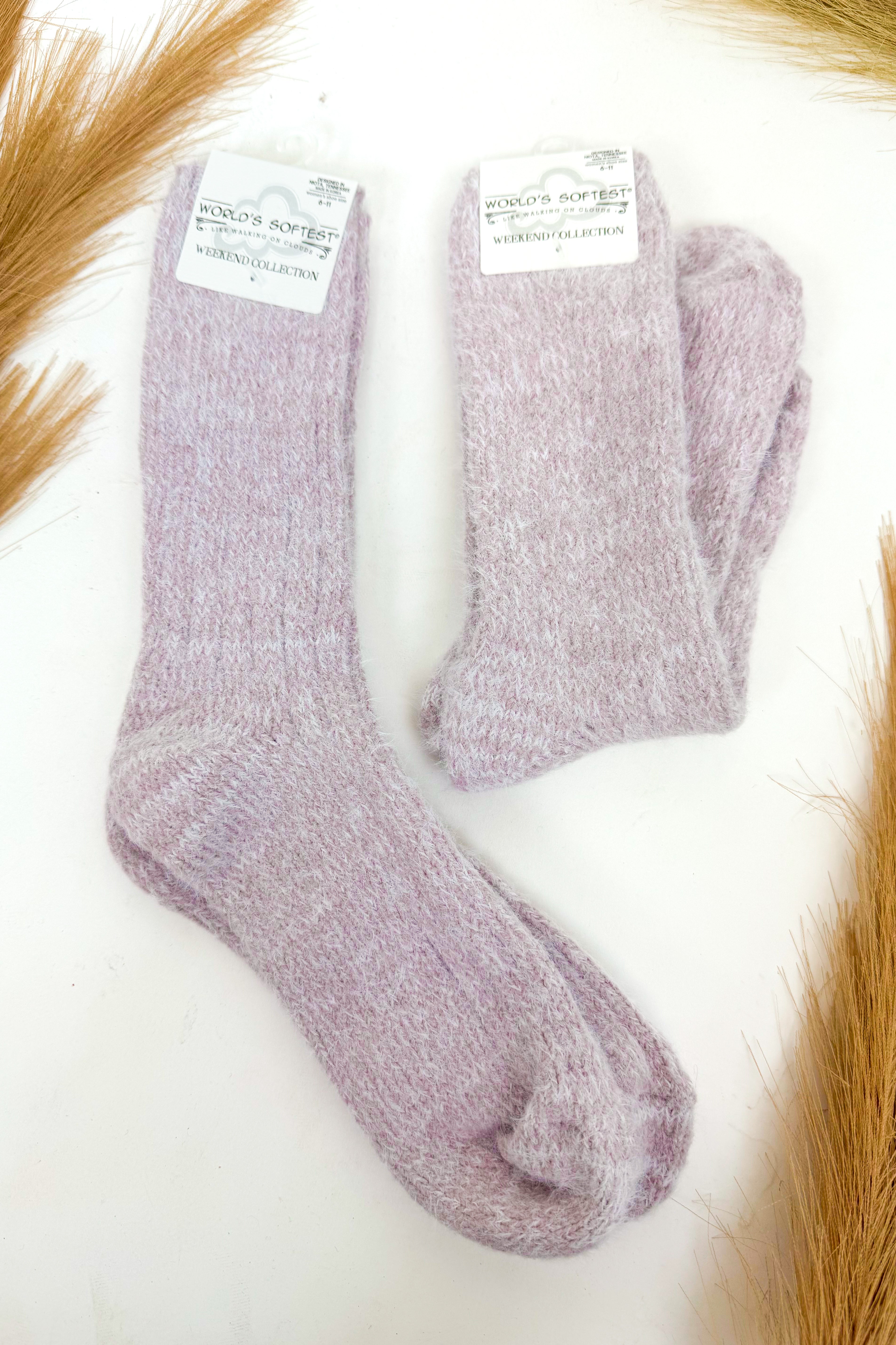 light purple plush socks against a white background