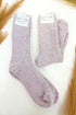 light purple plush socks against a white background