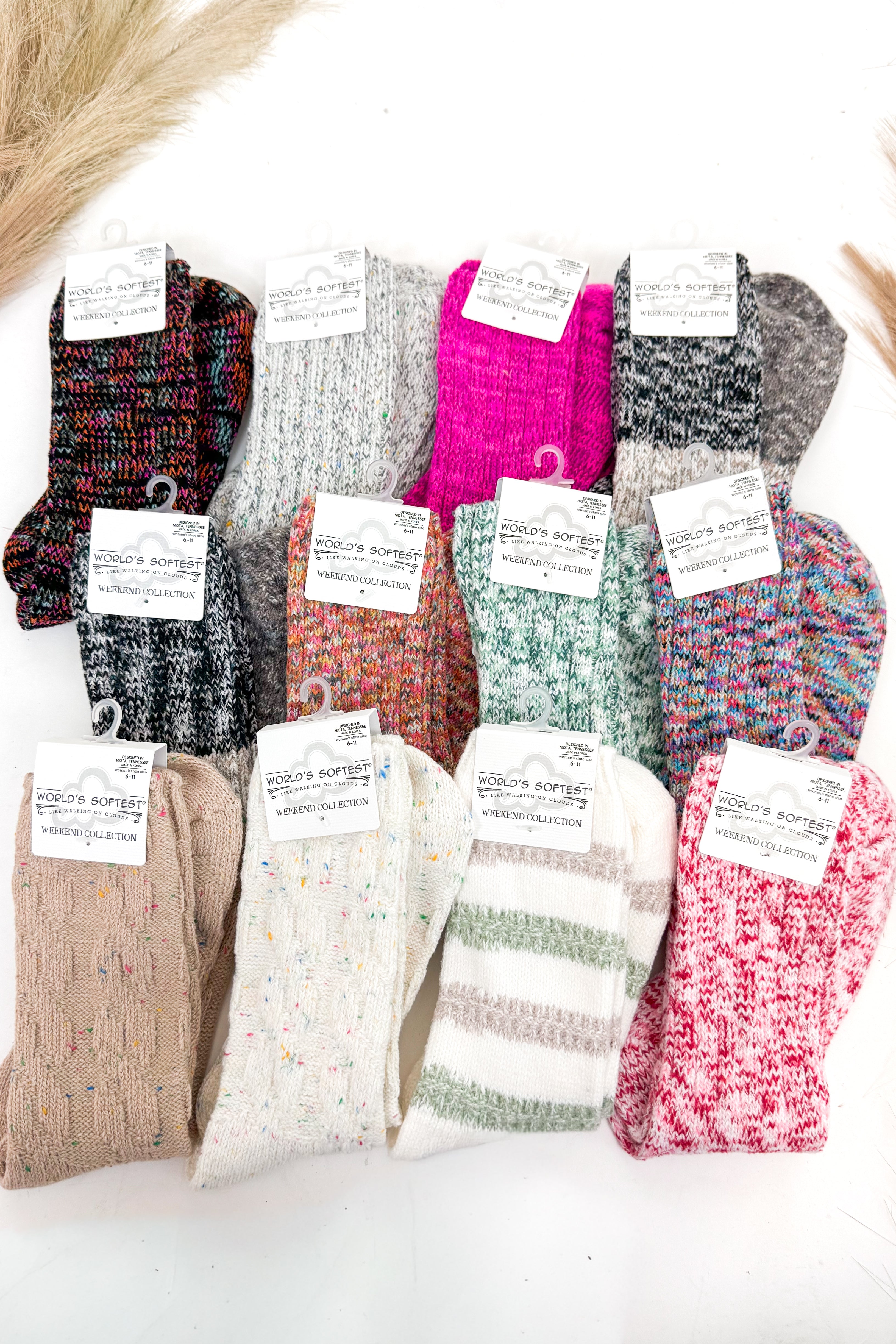 an array of colorful socks against a white background