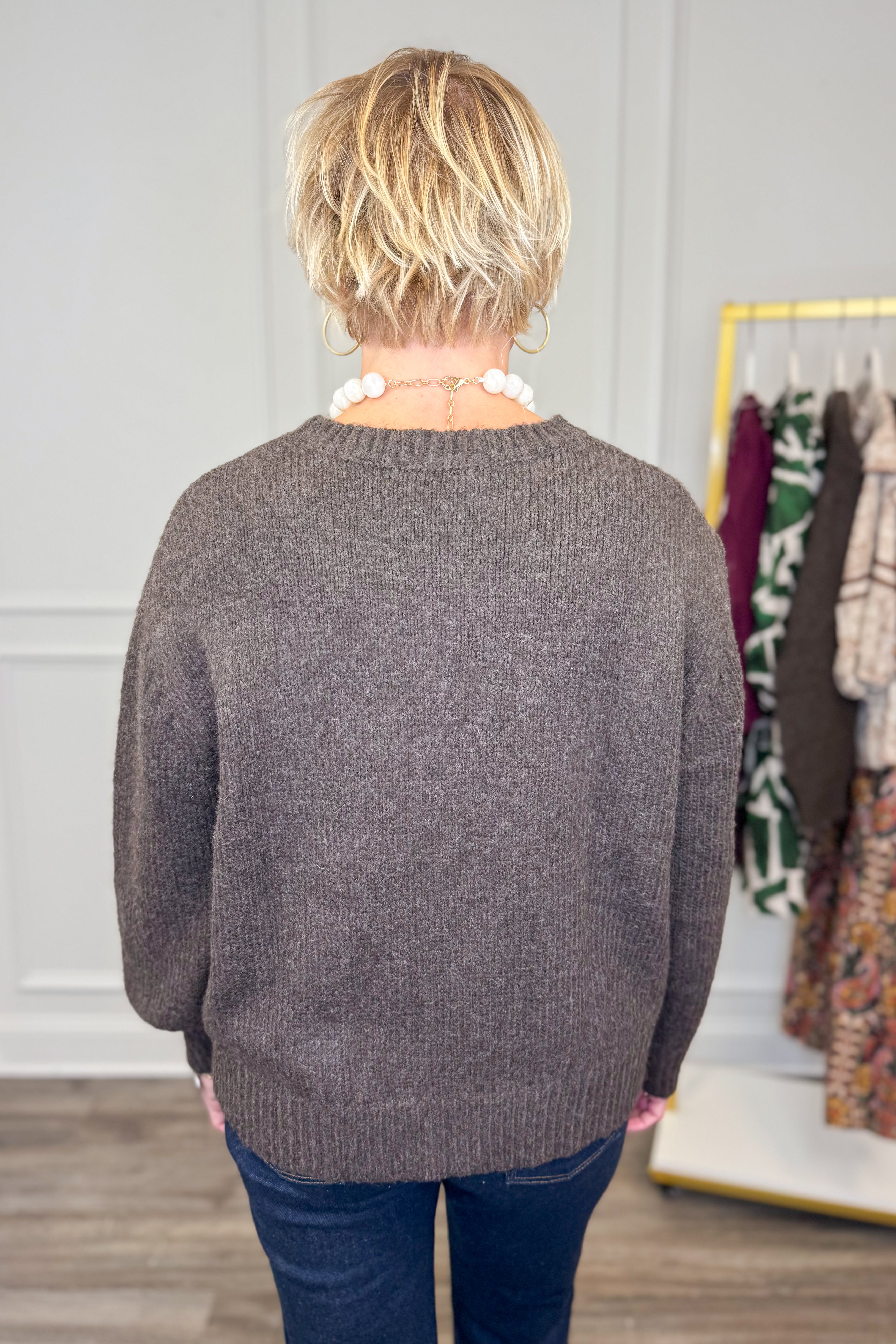 Rear view of woman wearing Corks & Cozy Brown Pocket Detail Sweater