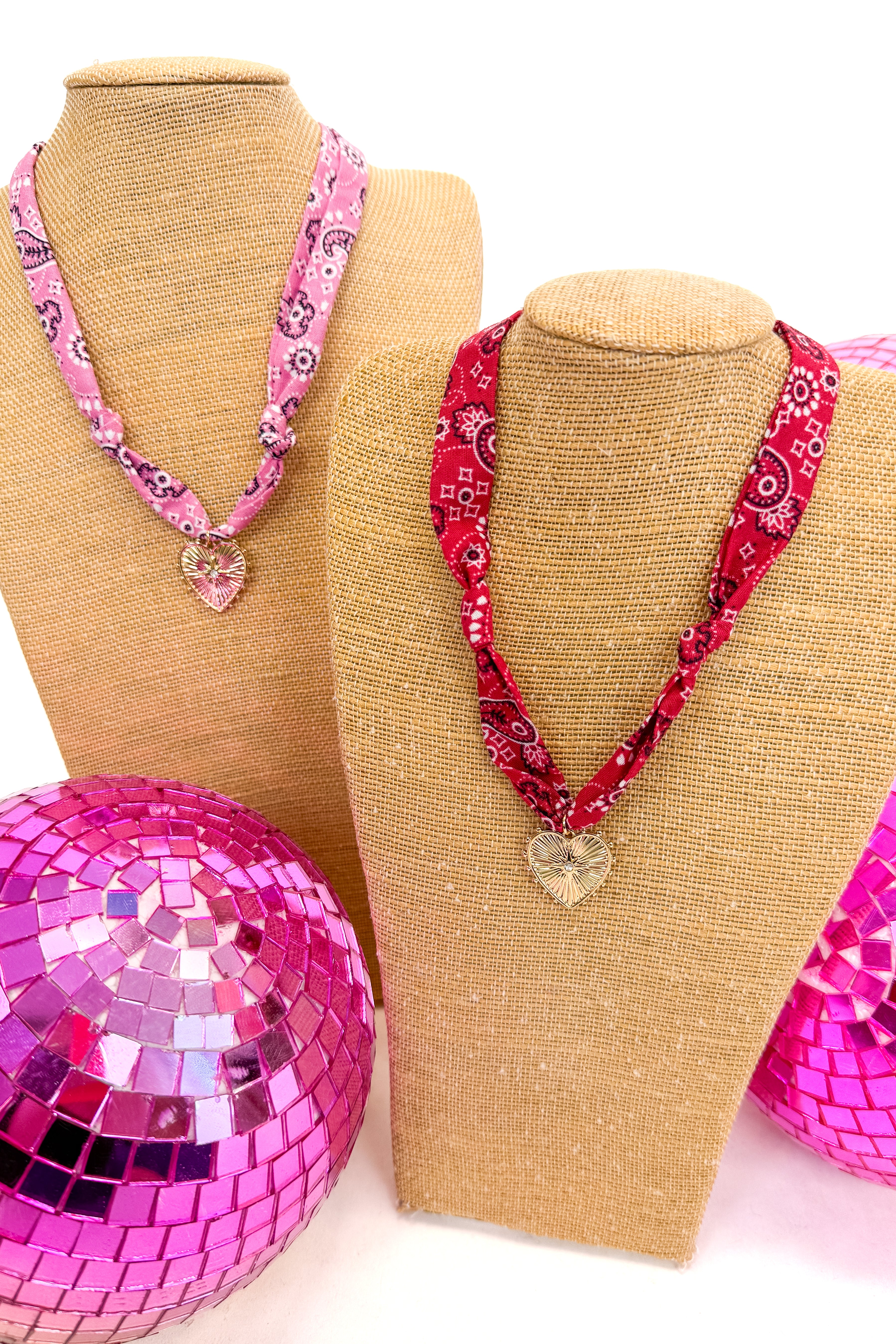 pink and red bandana scarf necklaces with heart pendants on each
