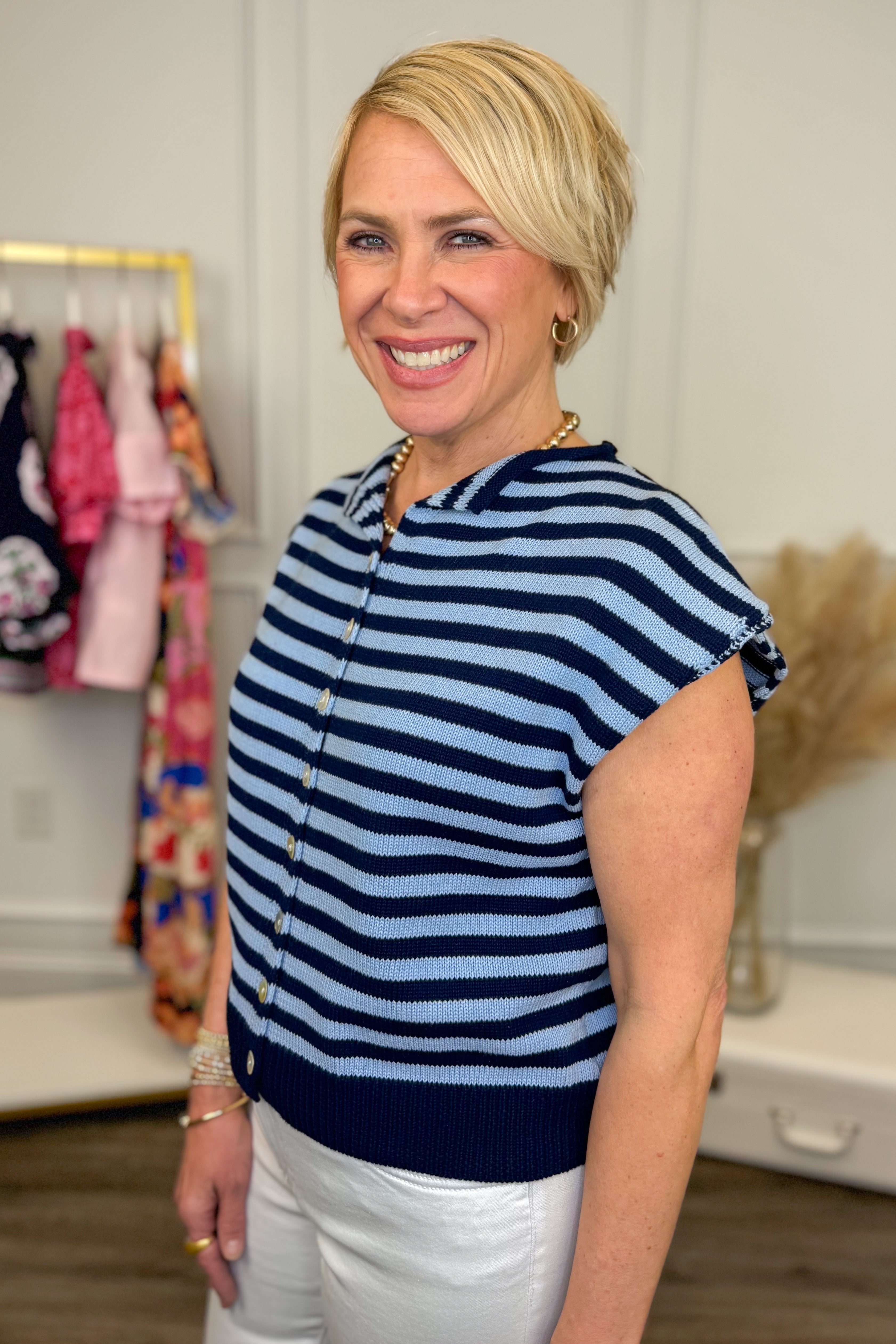 Woman wearing a blue and white striped shirt in a store setting