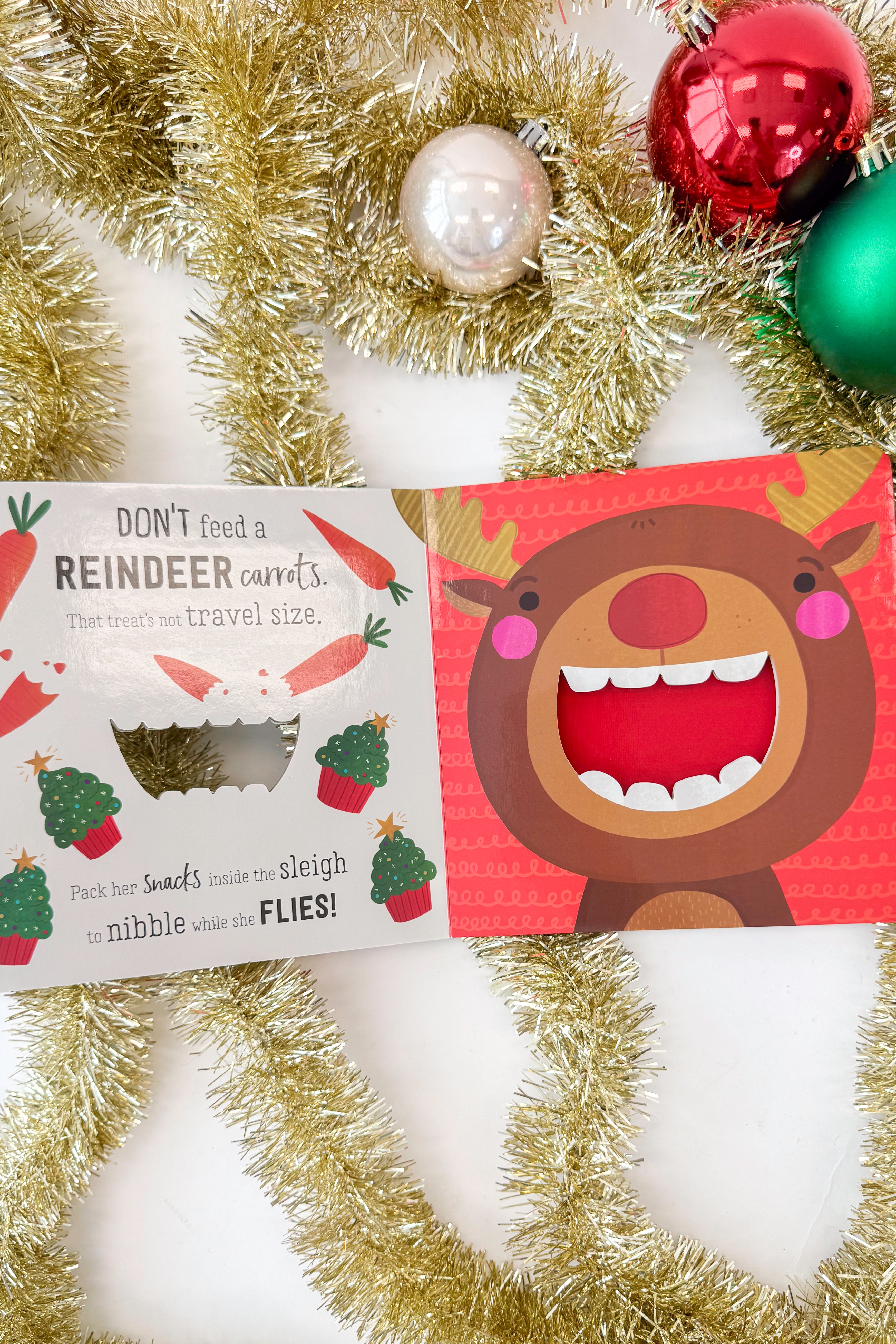 Book cover with a cartoon Reindeer face and text &