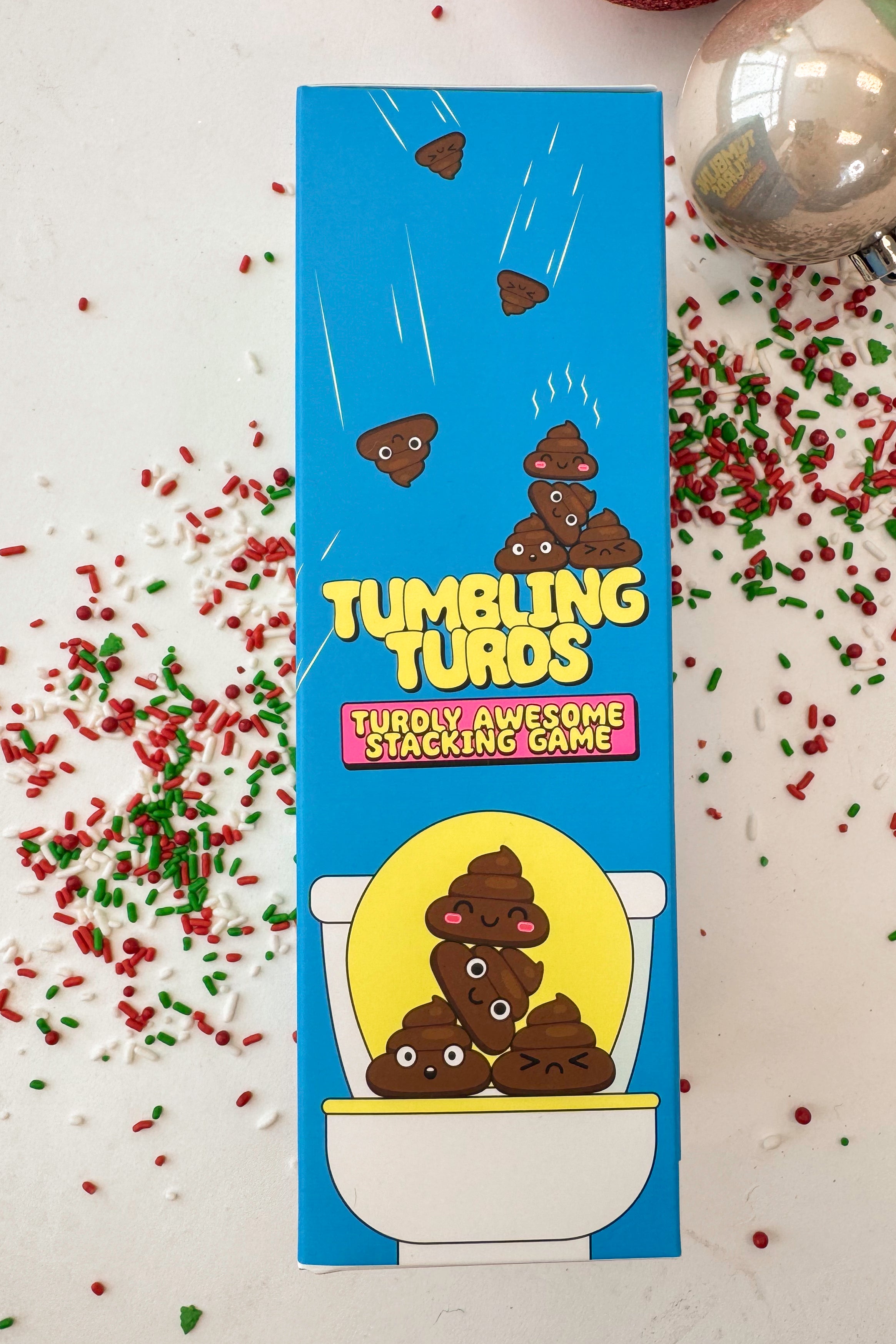 Box of Tumbling Turtles stacking game with blue background and yellow text