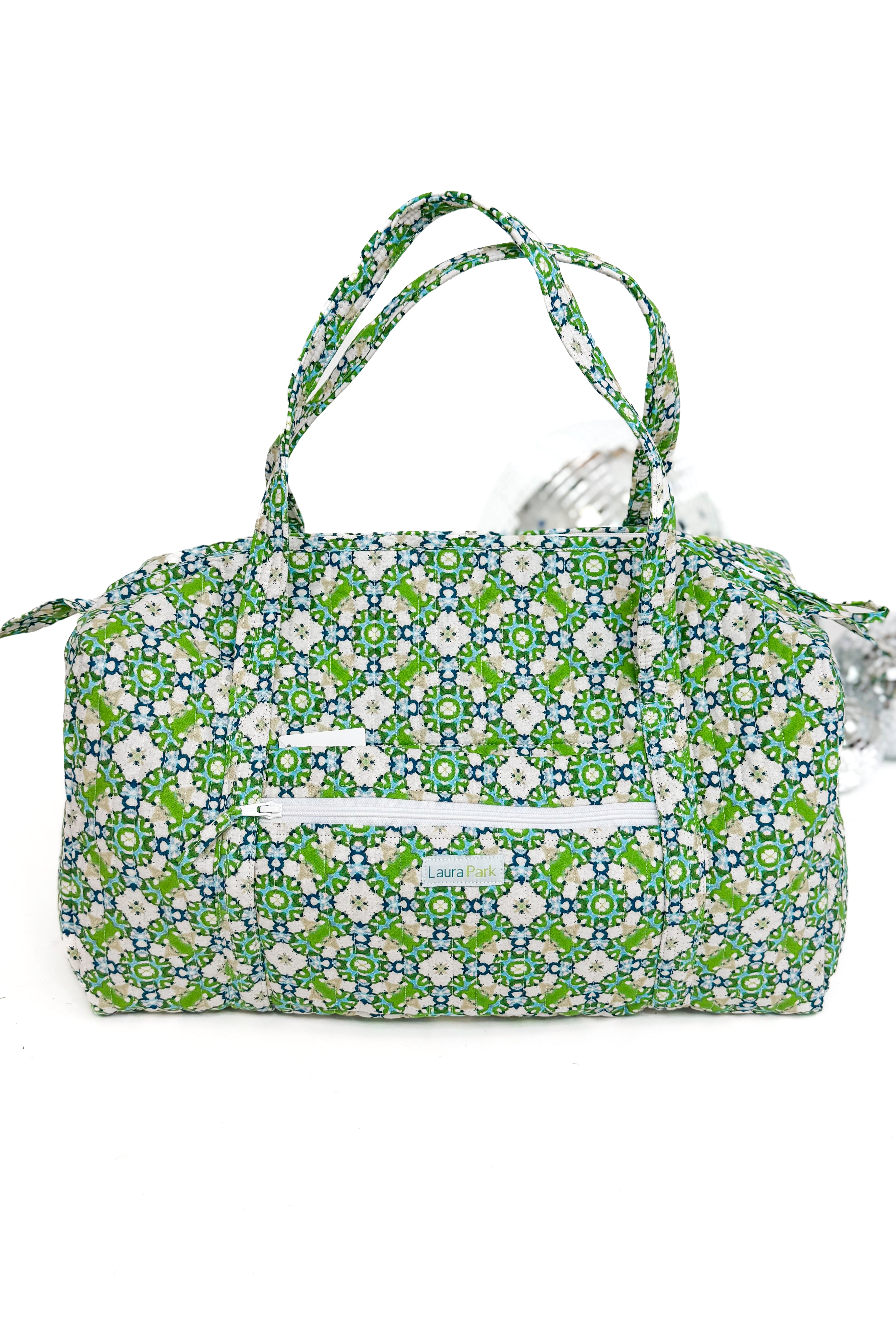 Floral patterned handbag on a white background
