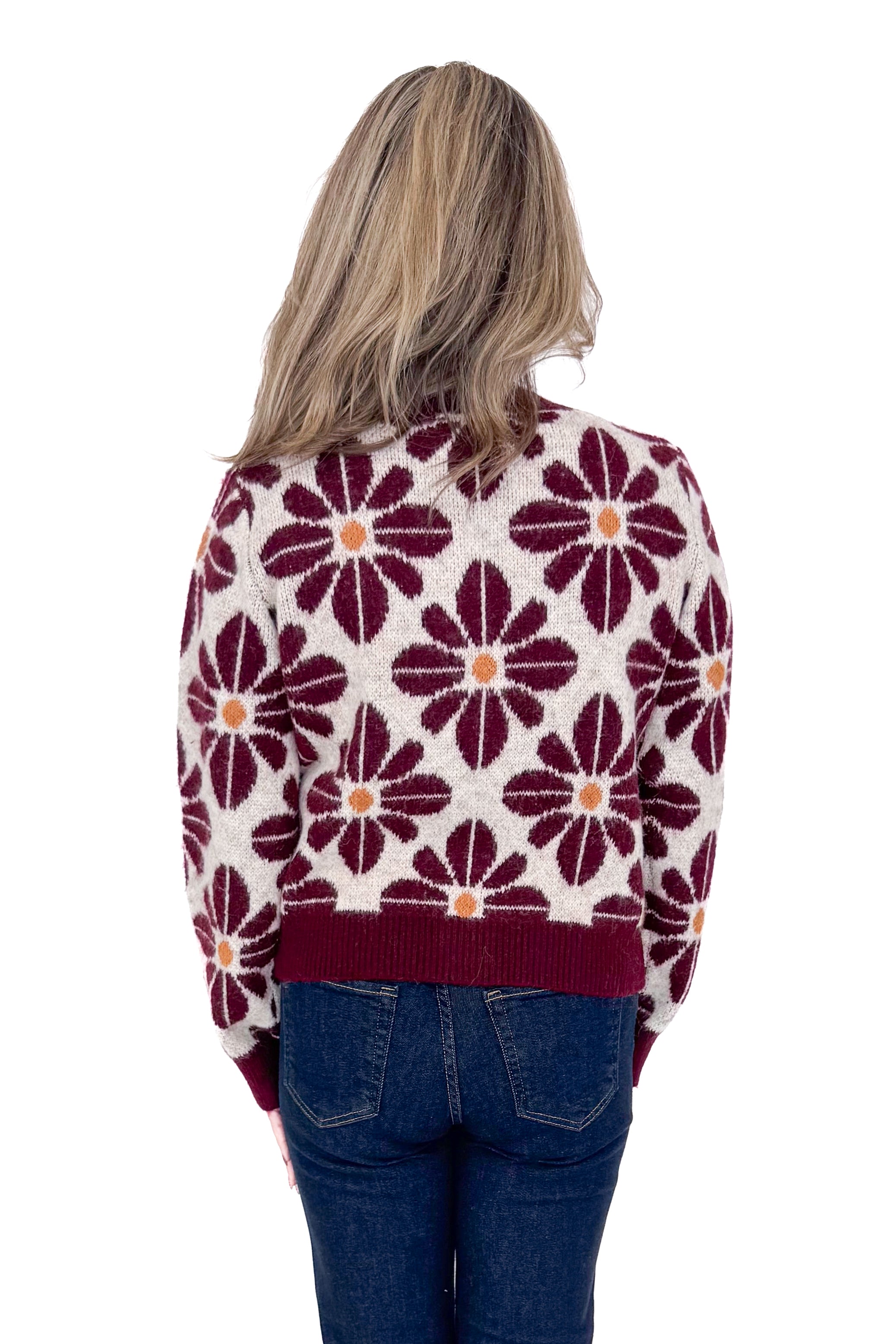 Back view of woman wearing Wine Floral Printed Button Up Cardigan by Entro with jeans against white studio background.