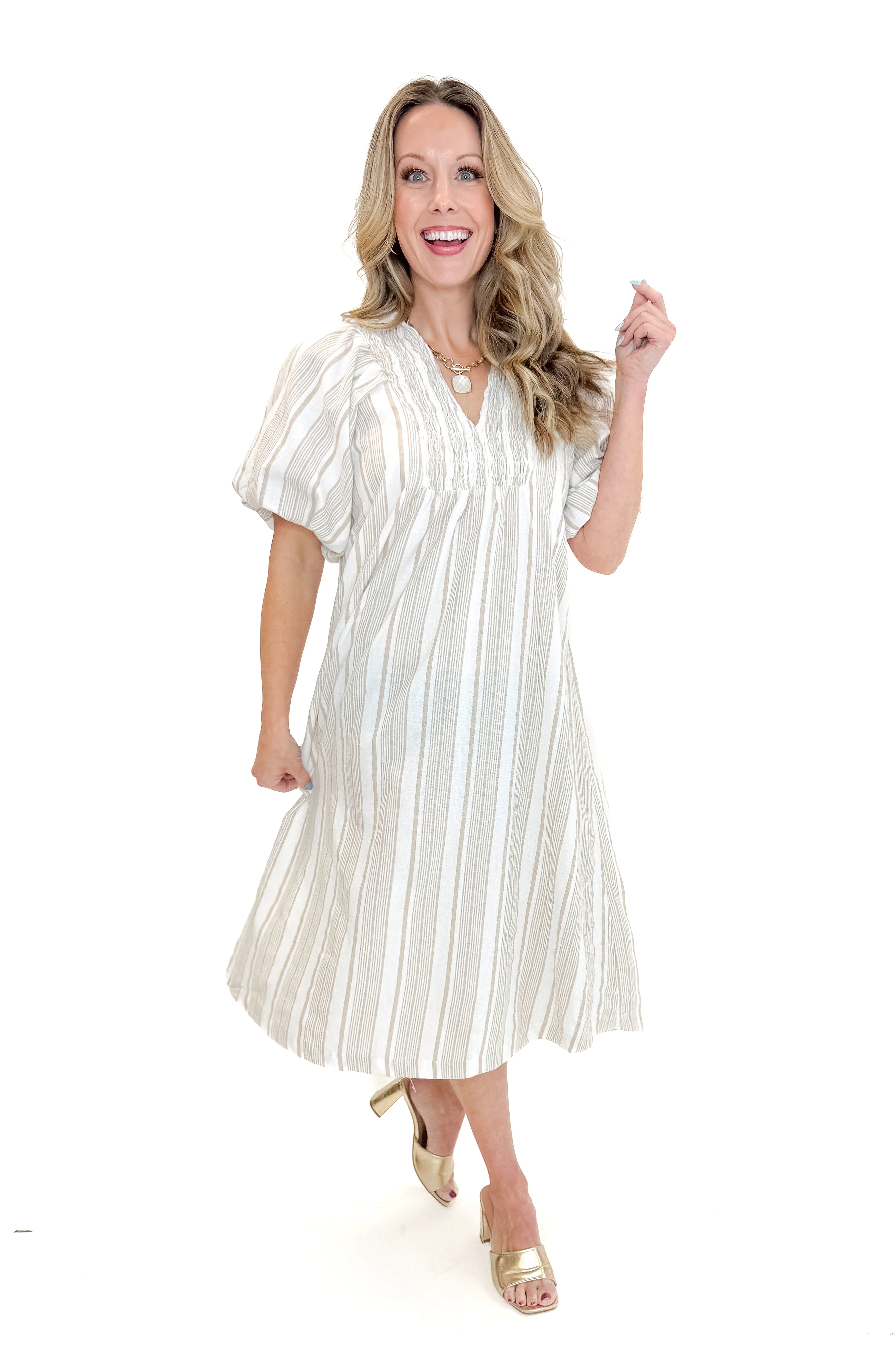 Front view of woman wearing Cream & Khaki Striped Midi Dress against white studio background.