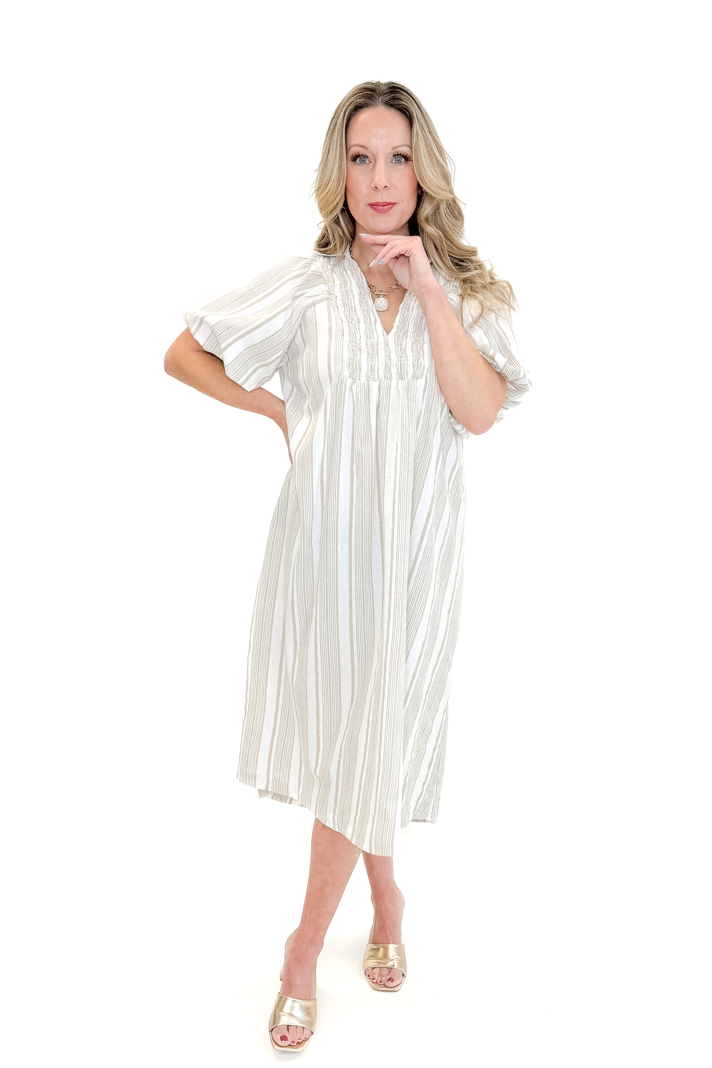 Front view of woman wearing Cream & Khaki Striped Midi Dress against white studio background.