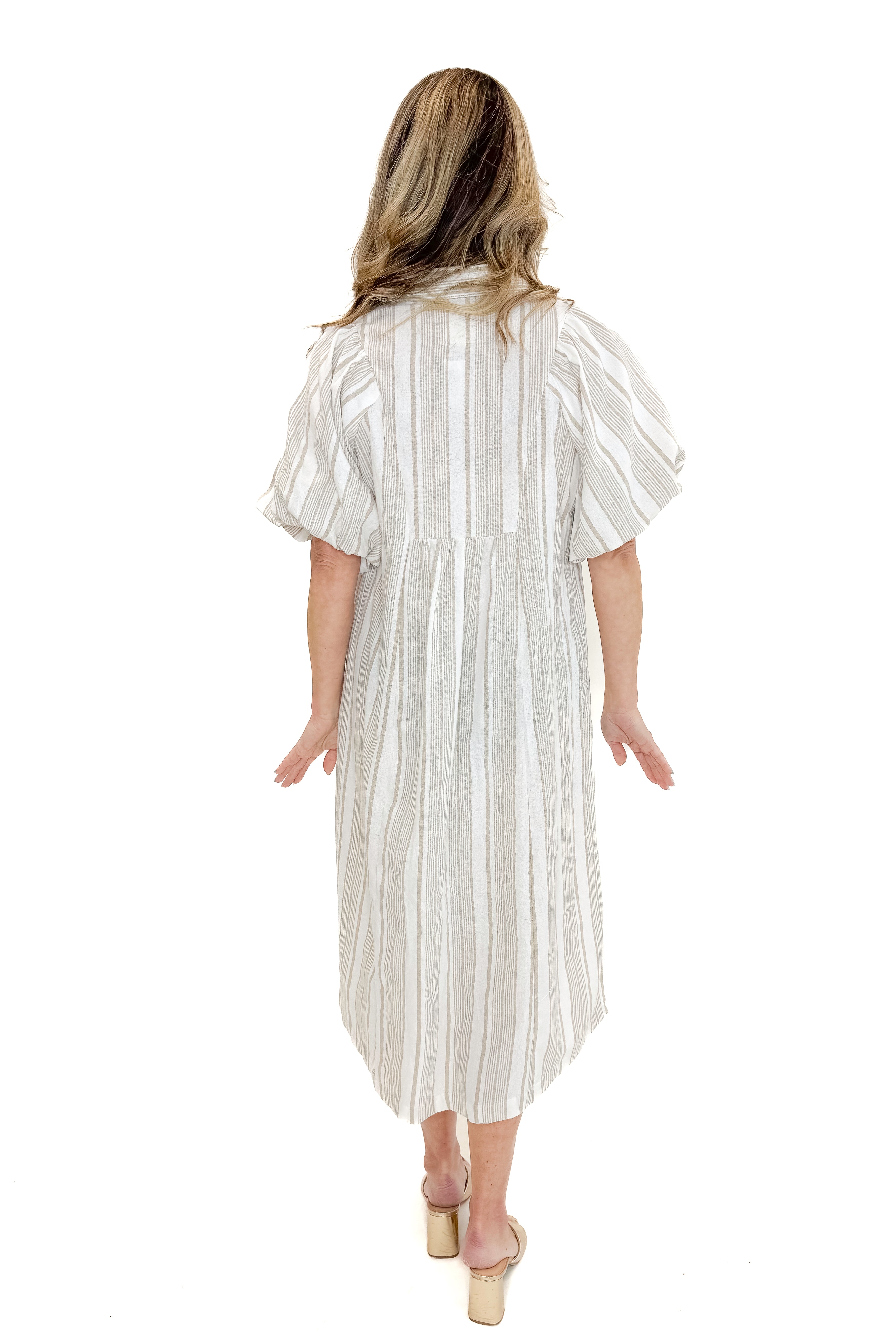 Back view of woman wearing Cream & Khaki Striped Midi Dress against white studio background.