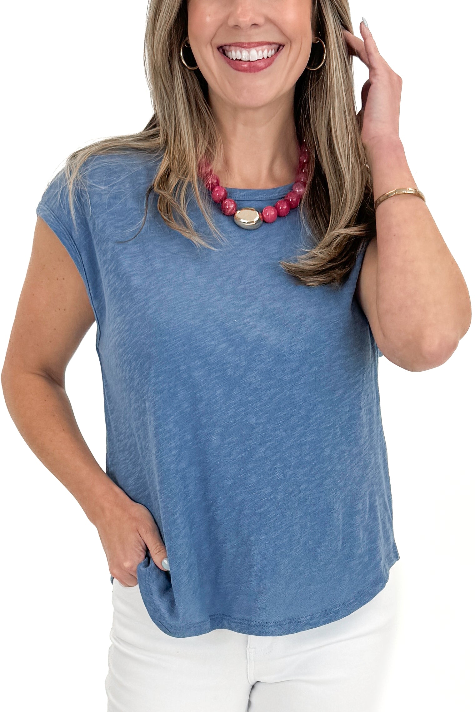 Front detail view of woman wearing Lake Blue Sol Slub Tank by Z Supply with jeans against white studio background.