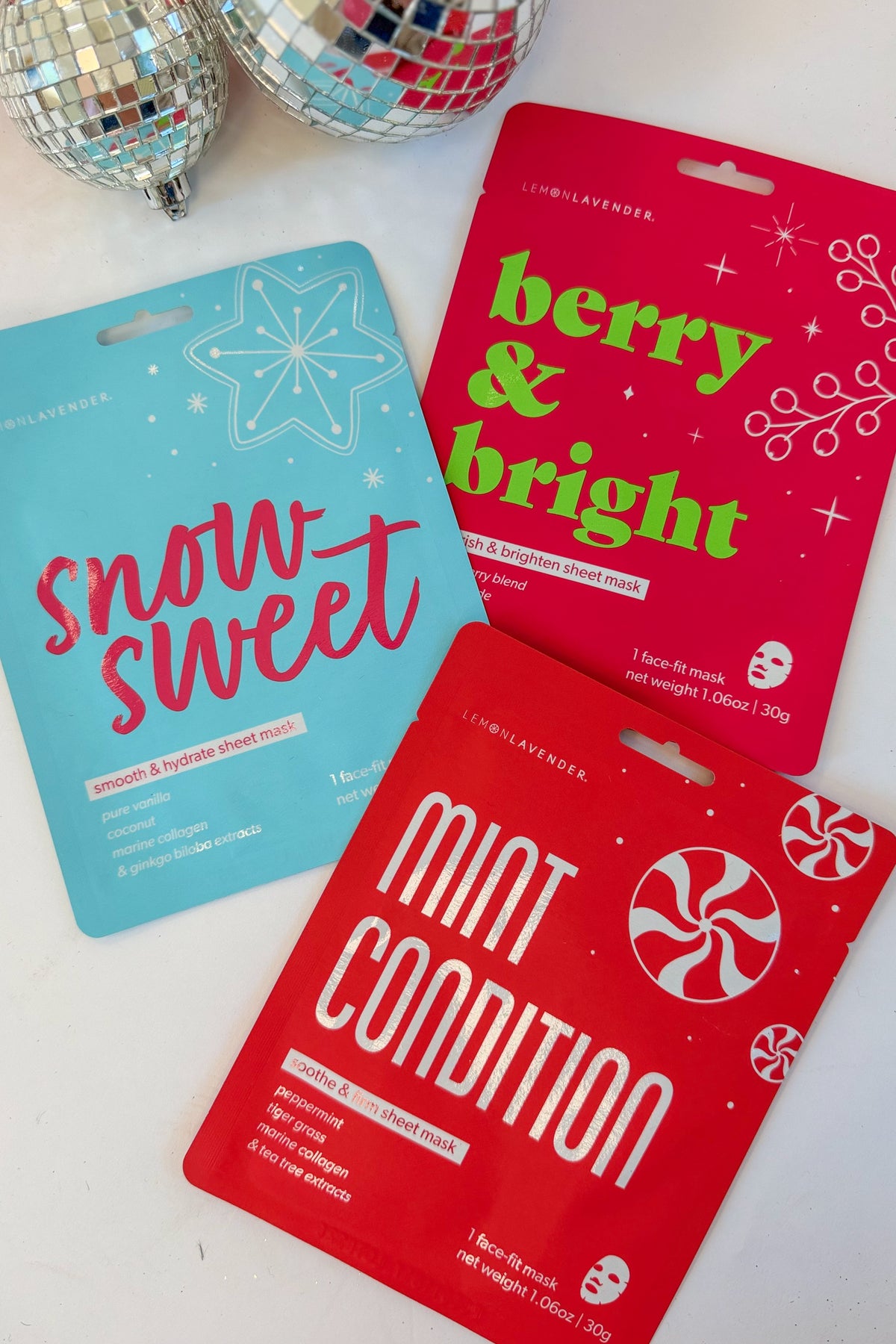Let It Glow Holiday Face Masks against holiday background.