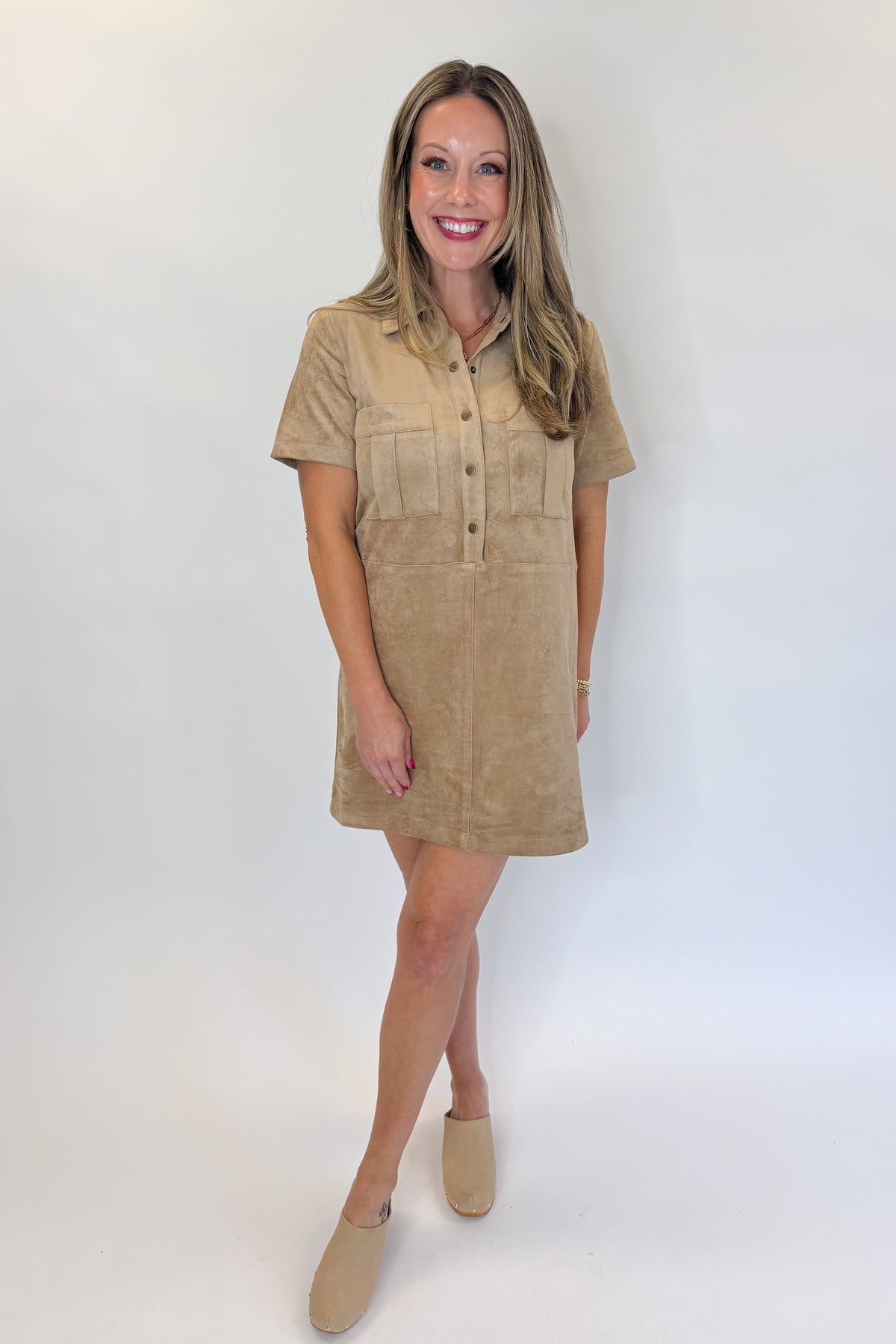 Front view of woman wearing Swagger Boutique’s Light Sand Leone Suede Mini Dress by Zsupply against white studio background.