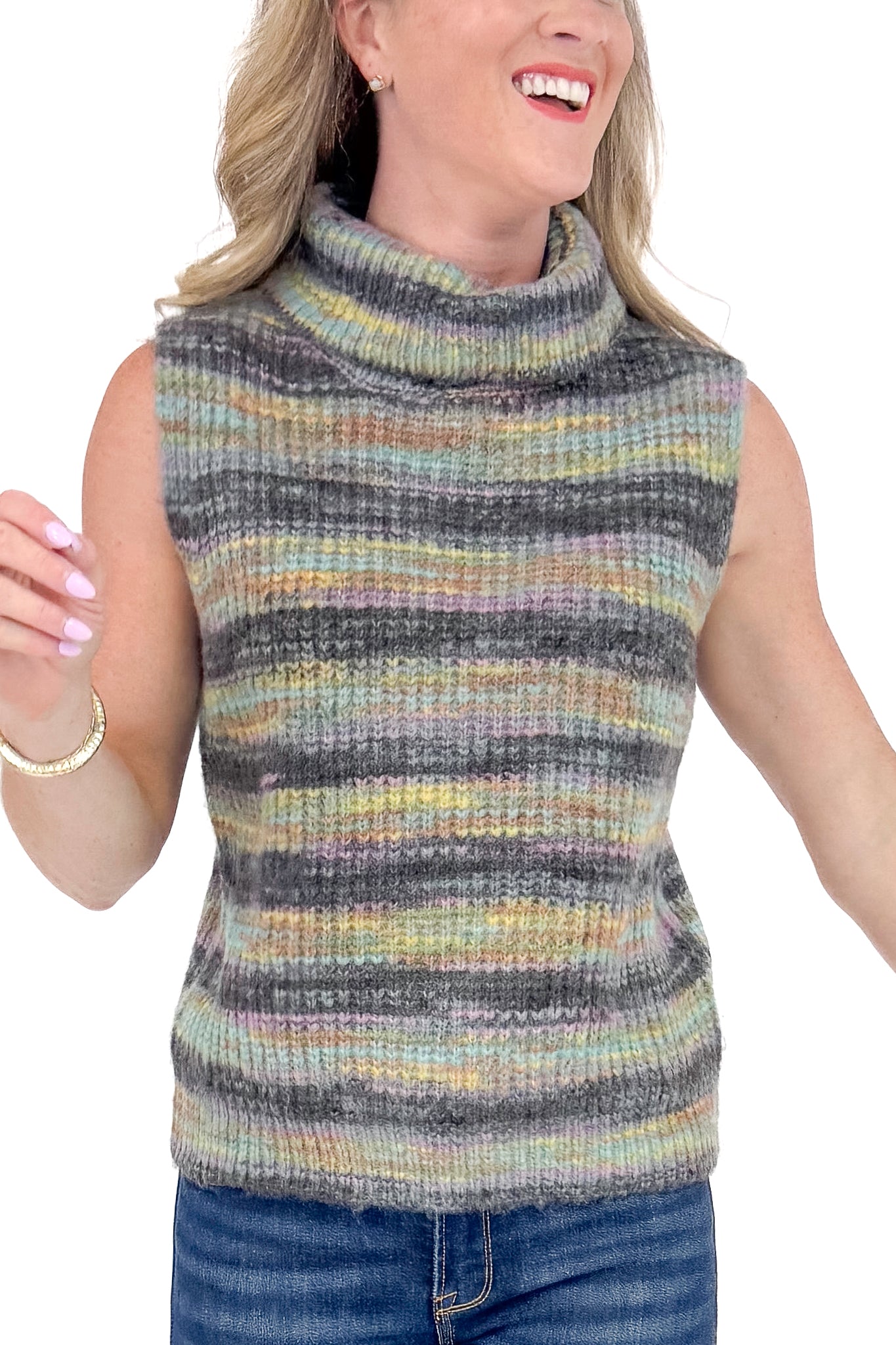 Woman wearing a sleeveless striped sweater with a plain background