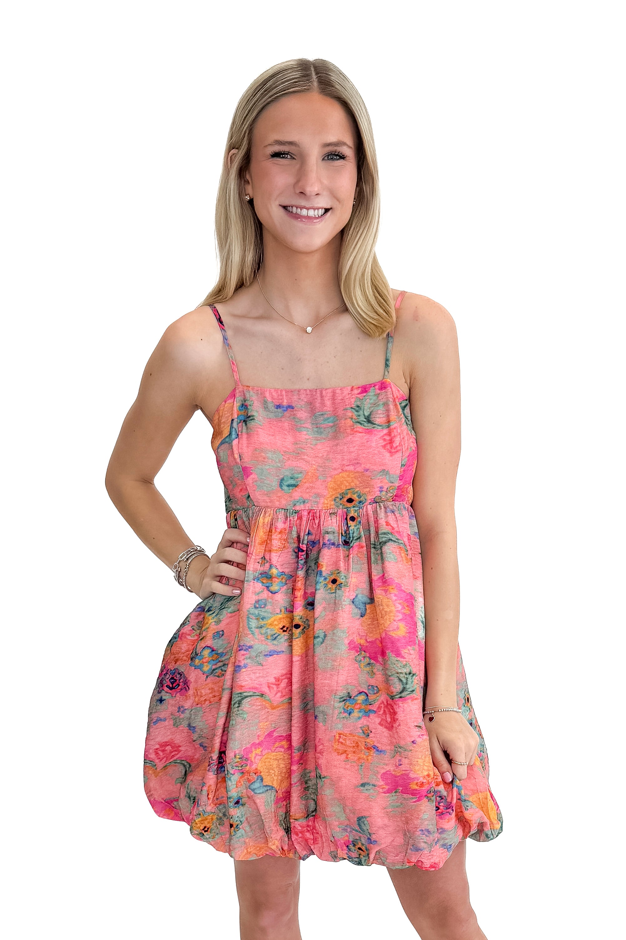 Front view of woman wearing Pink & Multi Printed Bubble Hem Tank Dress against white studio background.