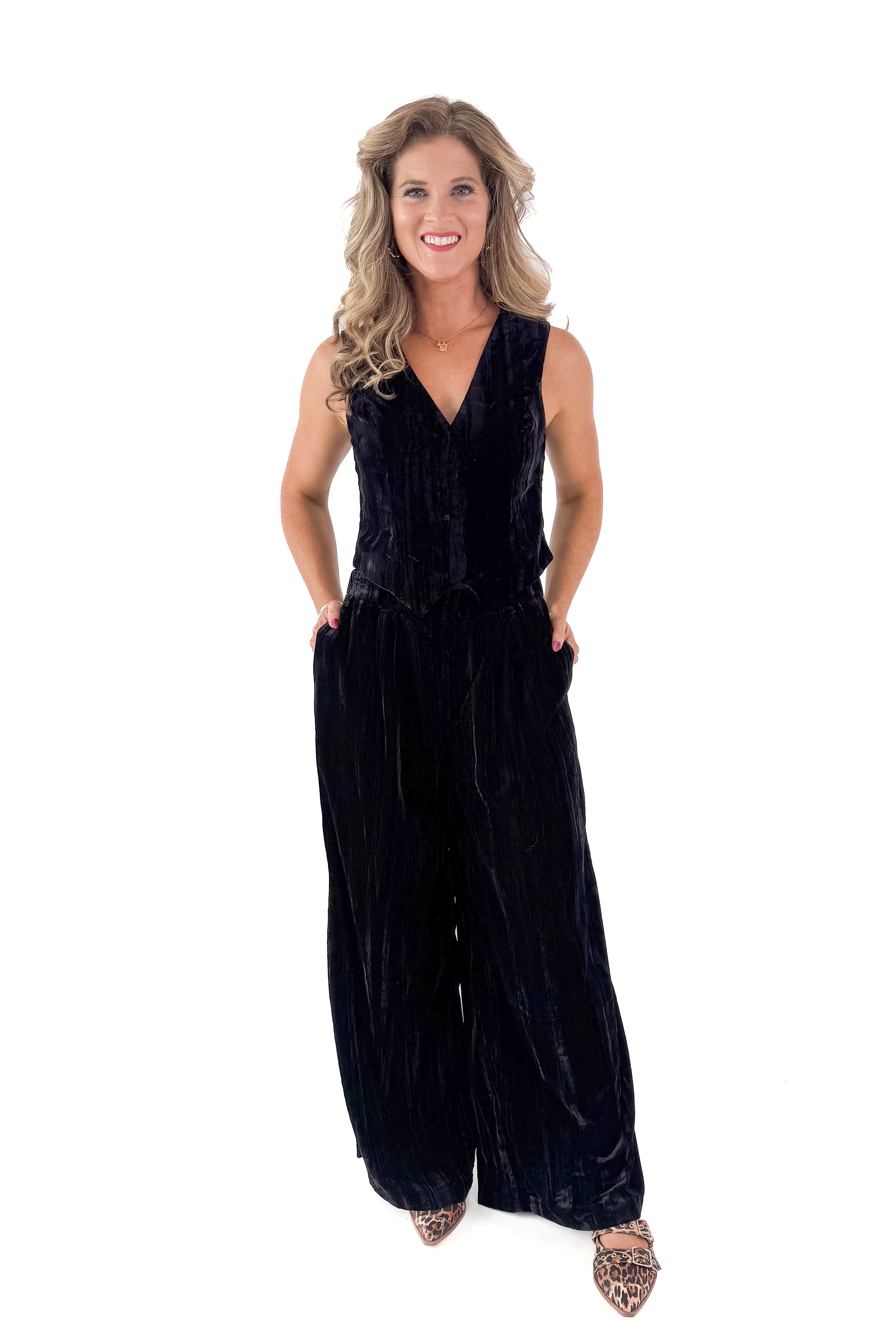 Front view of woman wearing Black Textured Velvet Wide Leg Pants and matching tank against white studio background.