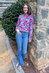 A Cut Above blue and pink floral printed sweater - full length model shot outside learning