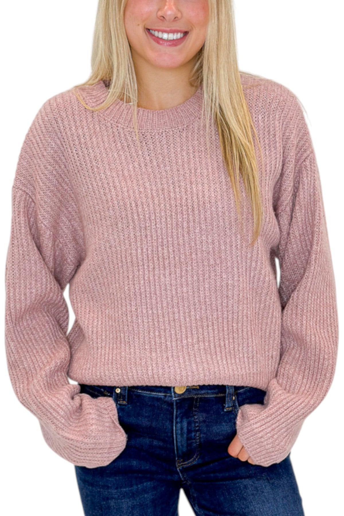 Front detail view of woman wearing Swagger Boutique’s Mauve Ribbed sweater with jeans against white studio background.