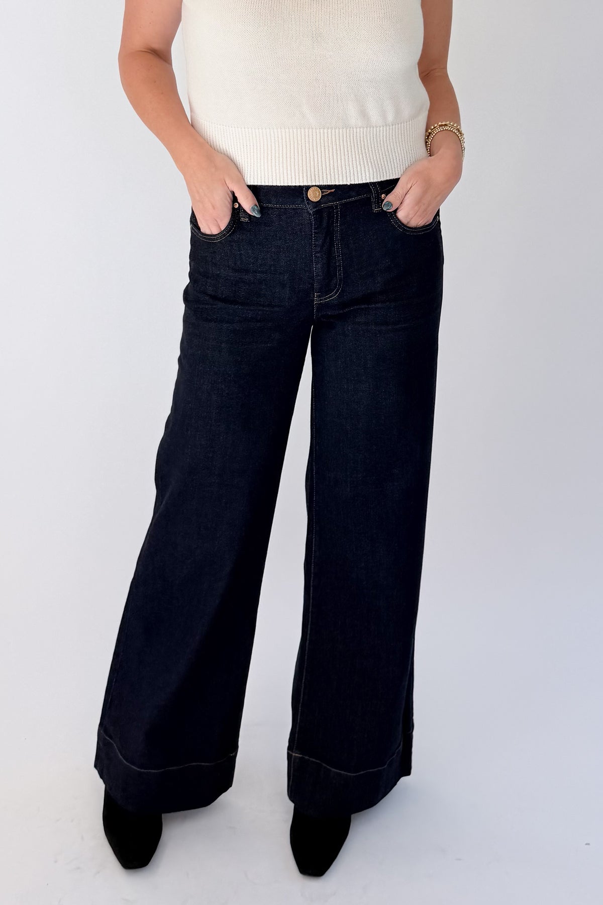 Front view of woman wearing Swagger Boutique’s sweater with Maya Wide Leg Jeans In Dark Wash- Amaze by Kut from the Kloth against white studio background.
