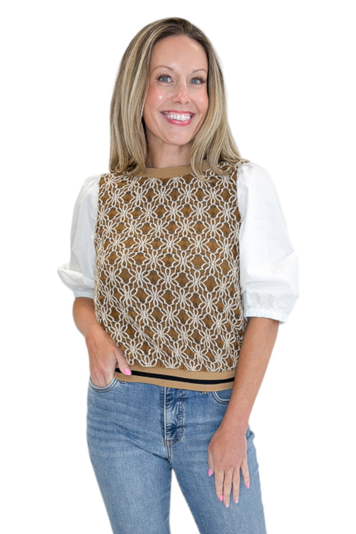 Front view of woman wearing Swagger Boutiqueās Mocha Floral Crocheted Contrast Sleeve Top with jeans against white studio background.