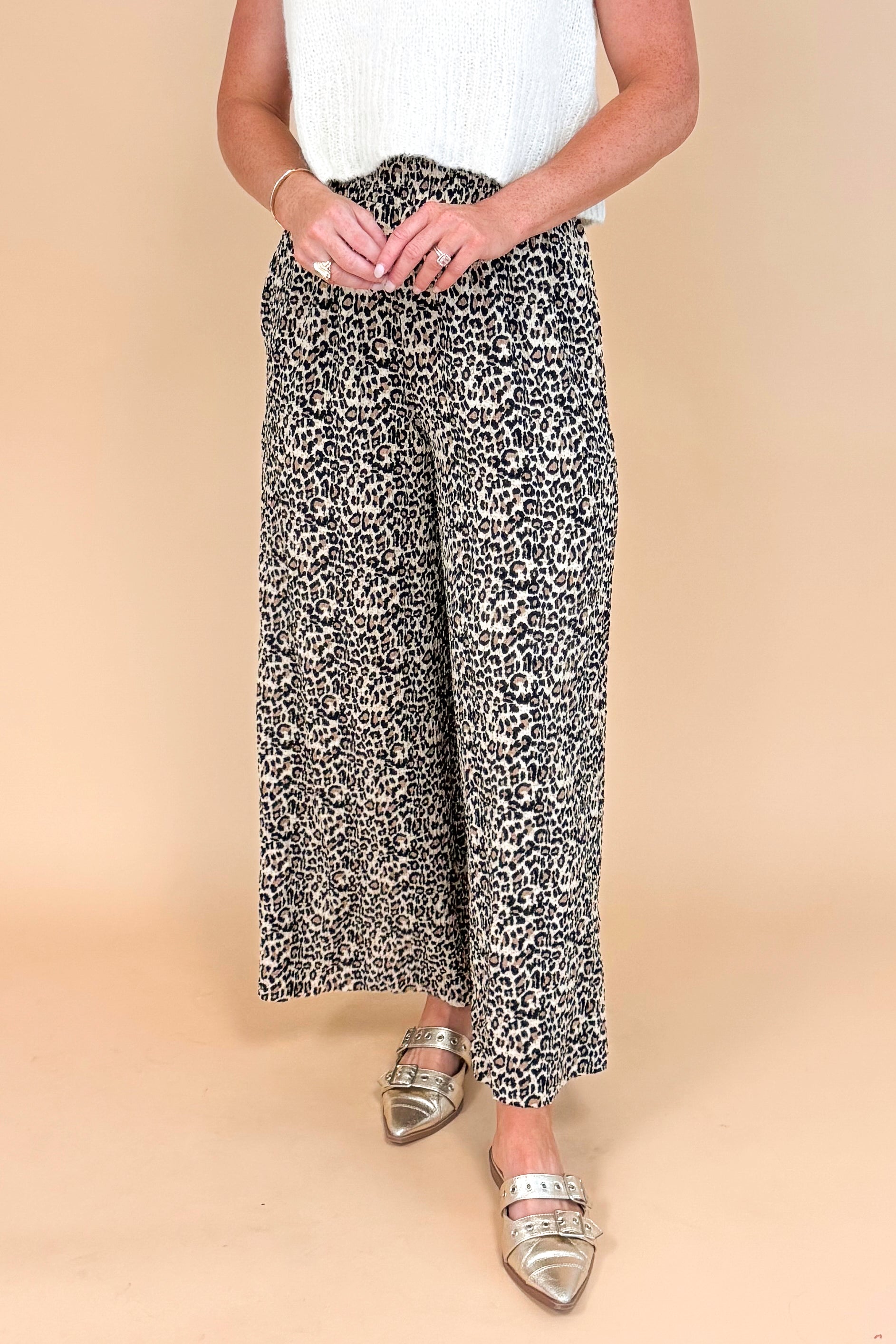 Leopard print textured pants - side view highlighting the wide leg silhouette and pleated details