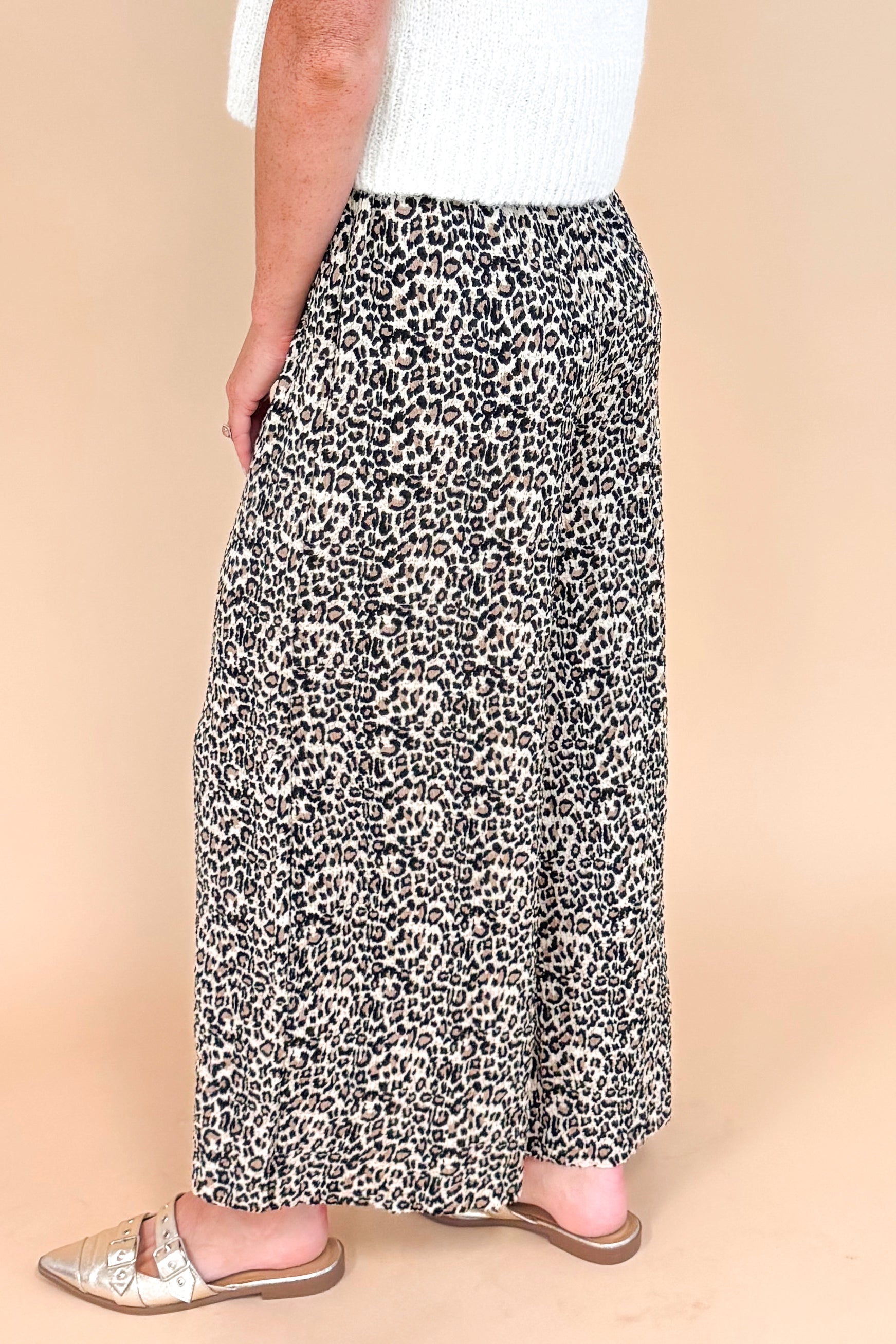 Leopard print textured pants - side view highlighting the wide leg silhouette and pleated details
