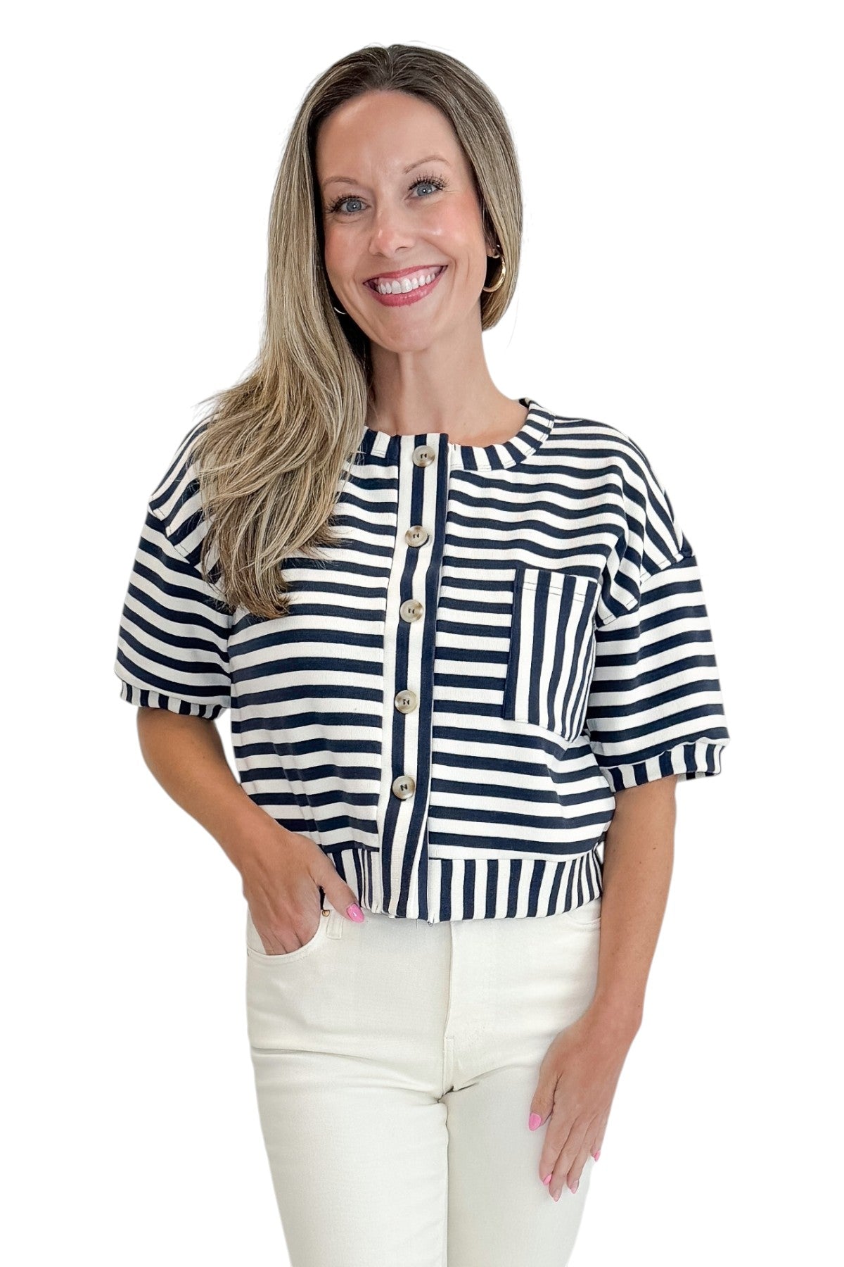 Front view of woman wearing Swagger Boutiqueβs Navy Striped Short Sleeve Button Up Top with jeans against white studio background.