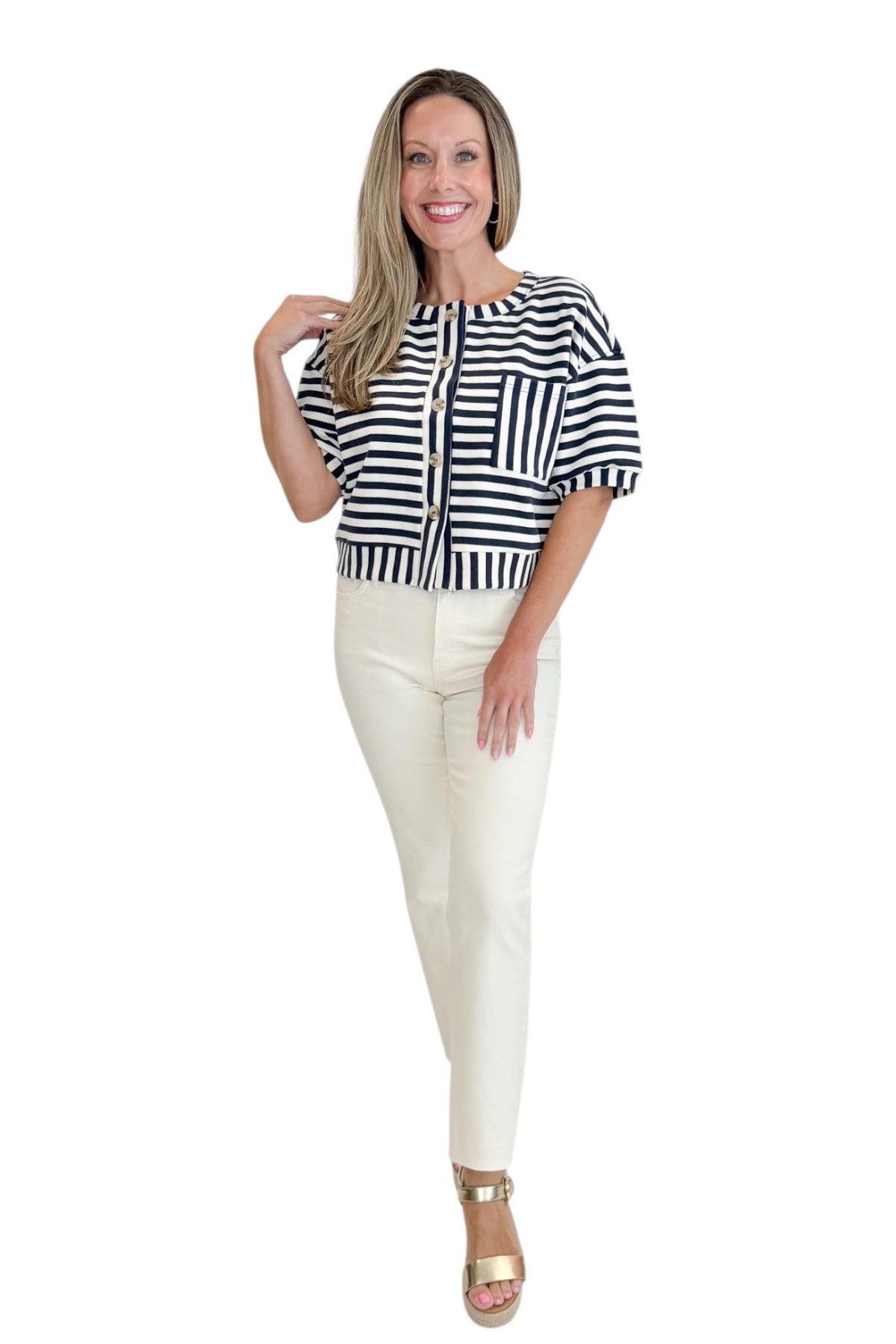 Front view of woman wearing Swagger Boutiqueβs Navy Striped Short Sleeve Button Up Top with jeans against white studio background.