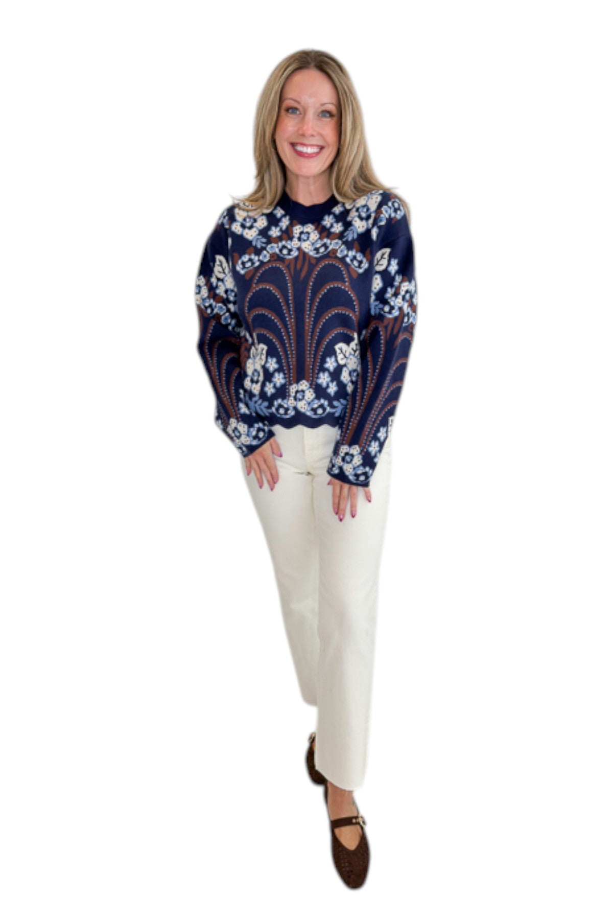 Front view of woman wearing Swagger Boutique’s Navy & Brown Printed Sweater by THML with jeans against white studio background.