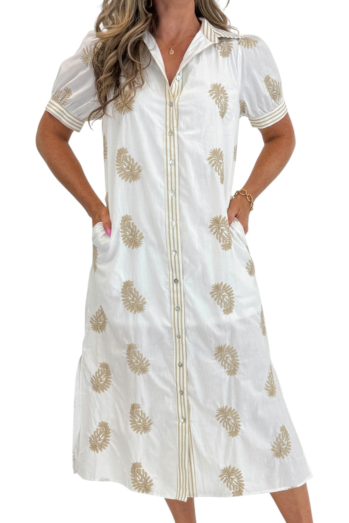 Front detail view of woman wearing Swagger Boutiqueβs Off White & Taupe Embroidered Midi Dress with sandals against white studio background.