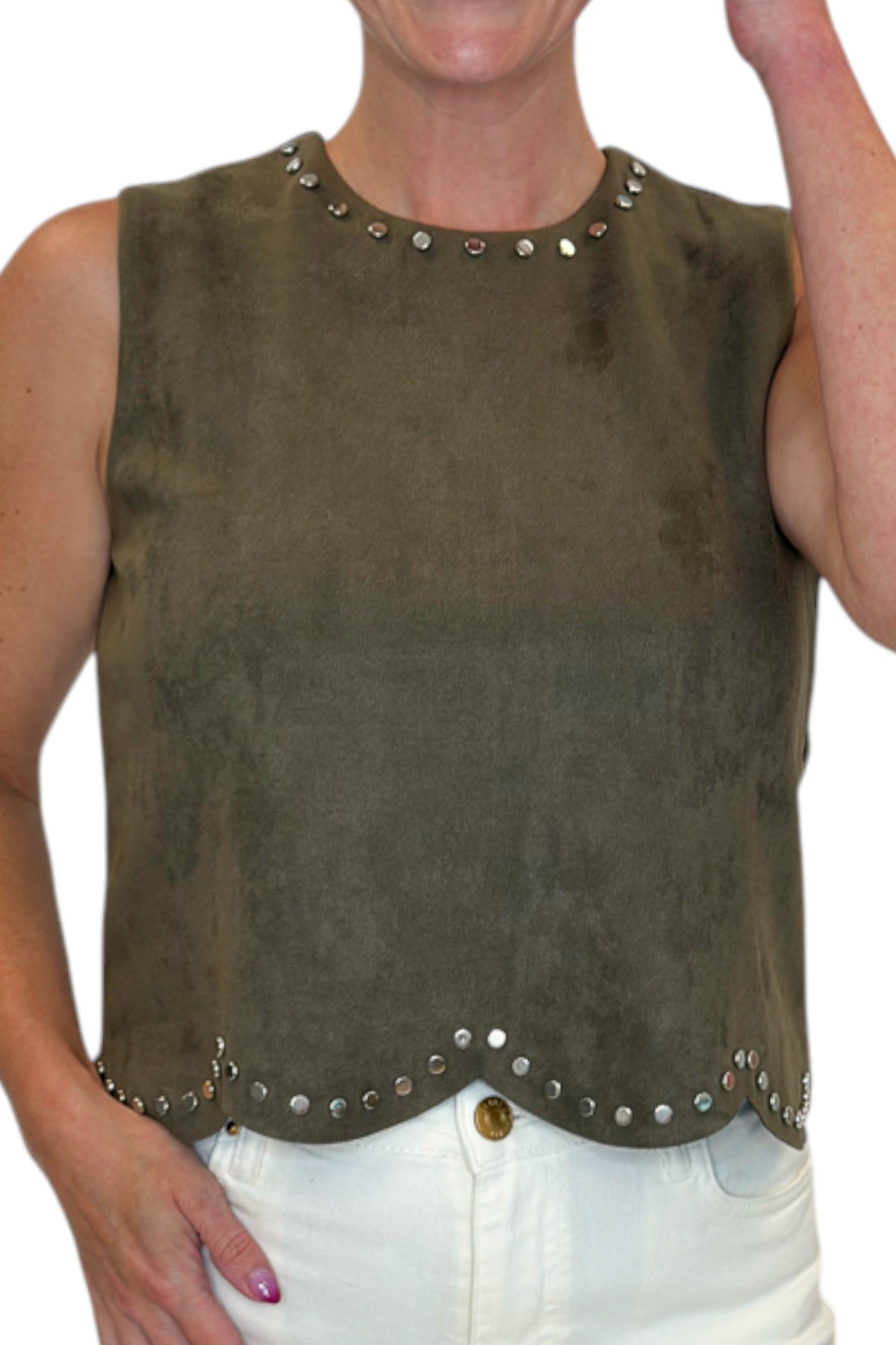 Front detail view of woman wearing Swagger Boutique’s Olive Suede Stud Tank with Kelsey Ecru Jeans against white studio background.