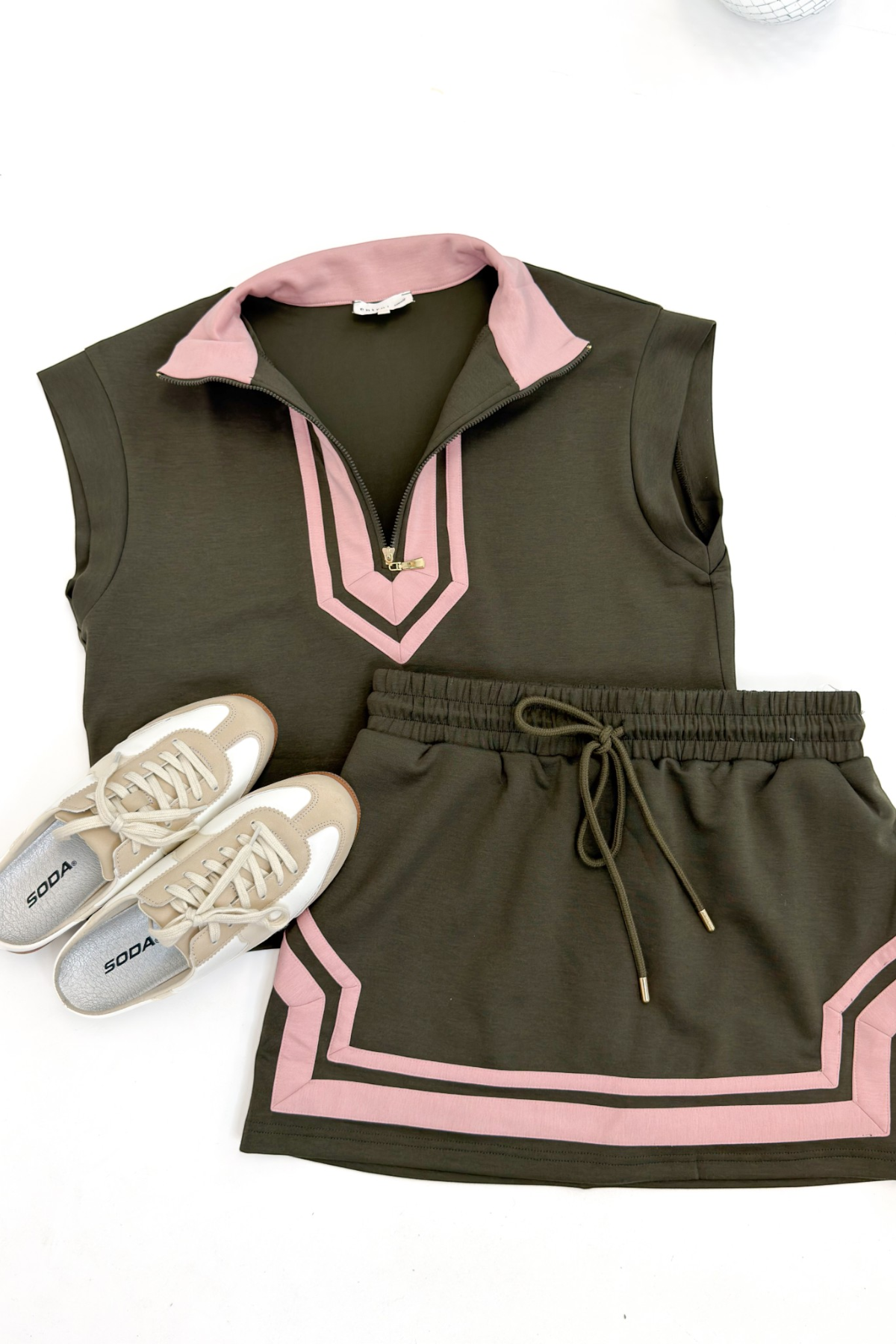 Swagger Boutique’s Olive & Pink Skirt & Matching Top by Entro flat lay against white studio background.
