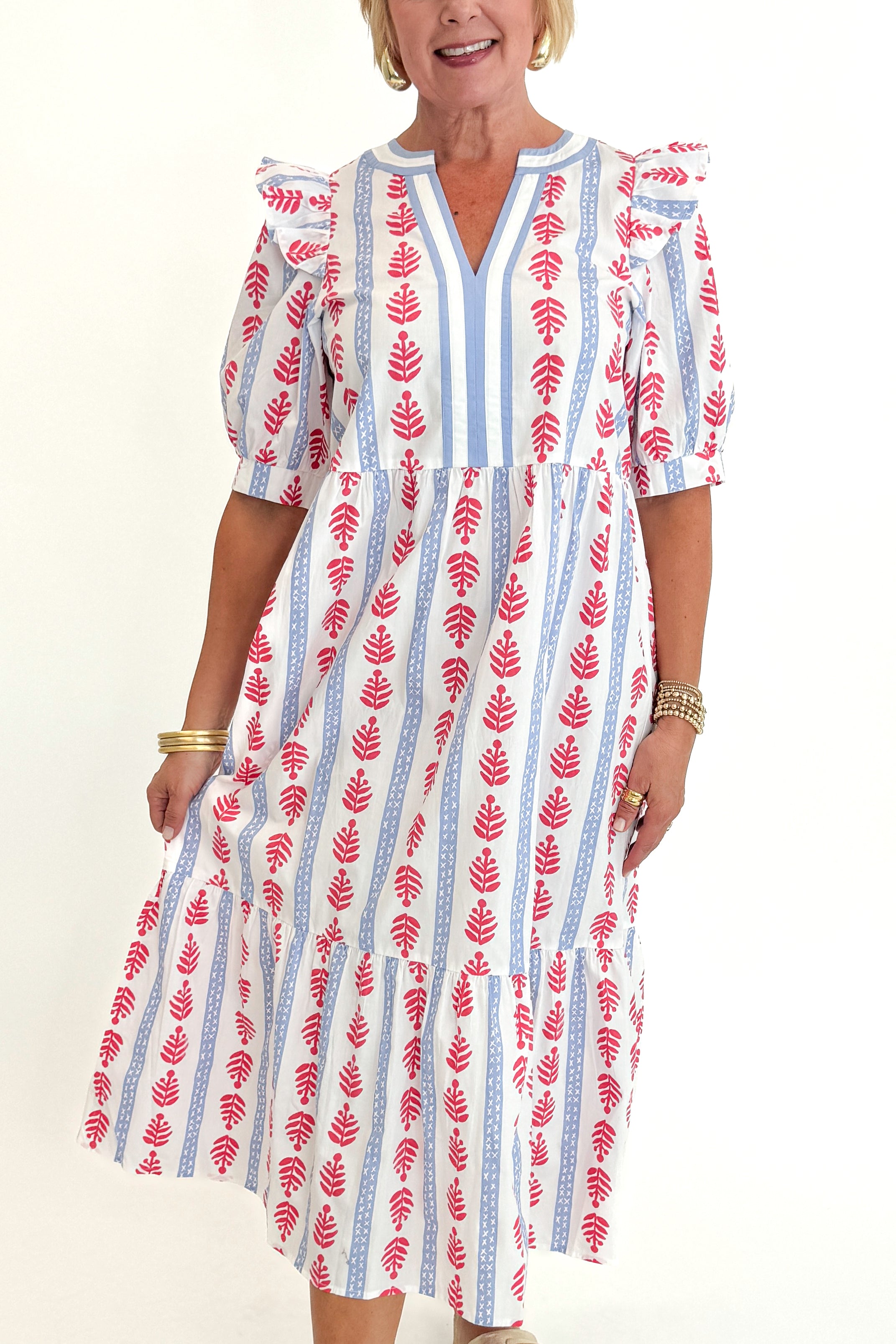 Front detail view of woman wearing Swagger Boutique’s Red, White & Blue Jonah Midi Dress by MudPie with Lulah Platform Sandals against white studio background.