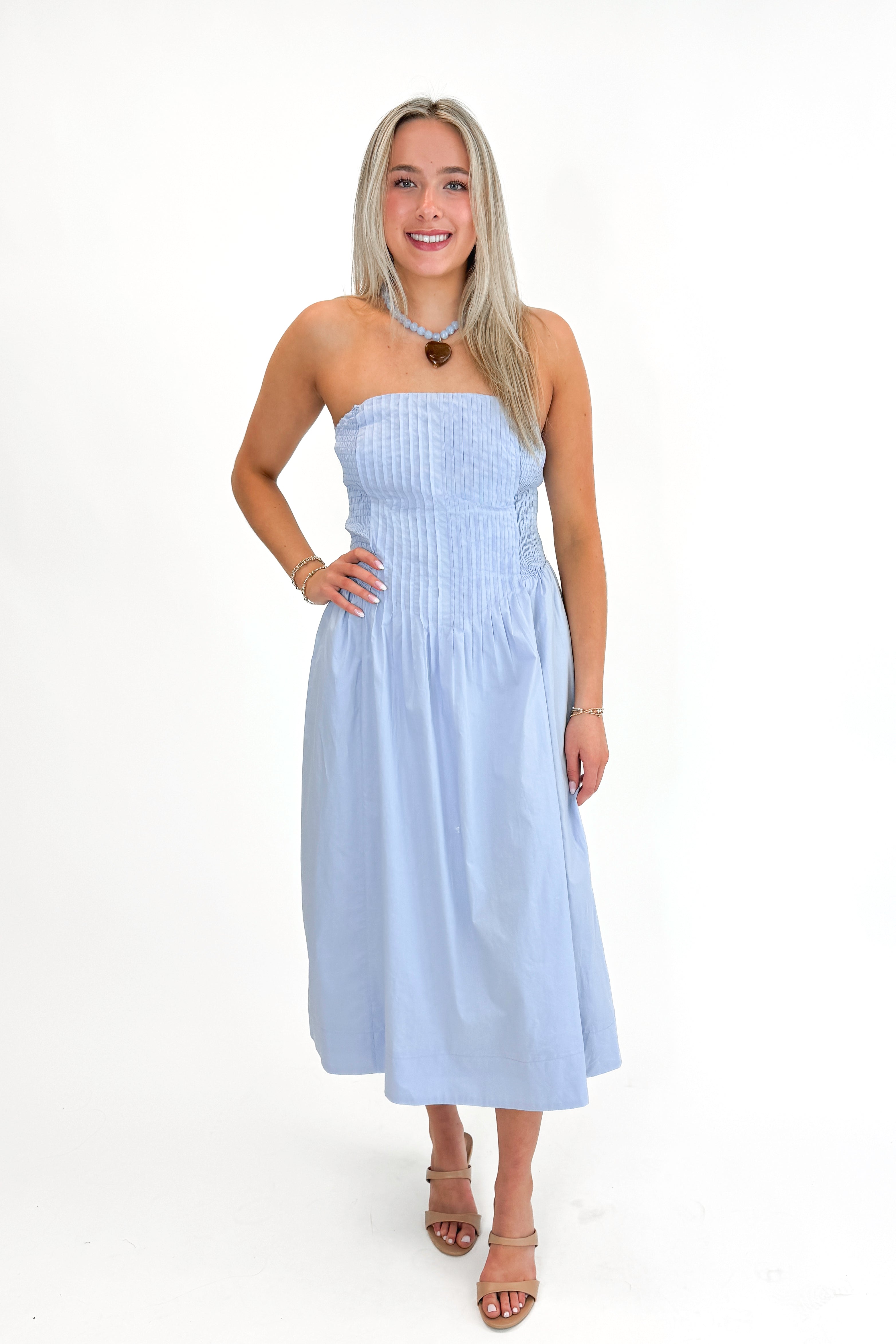 Front view of woman wearing Light Blue Pintucked Detail Midi Dress against white studio background.