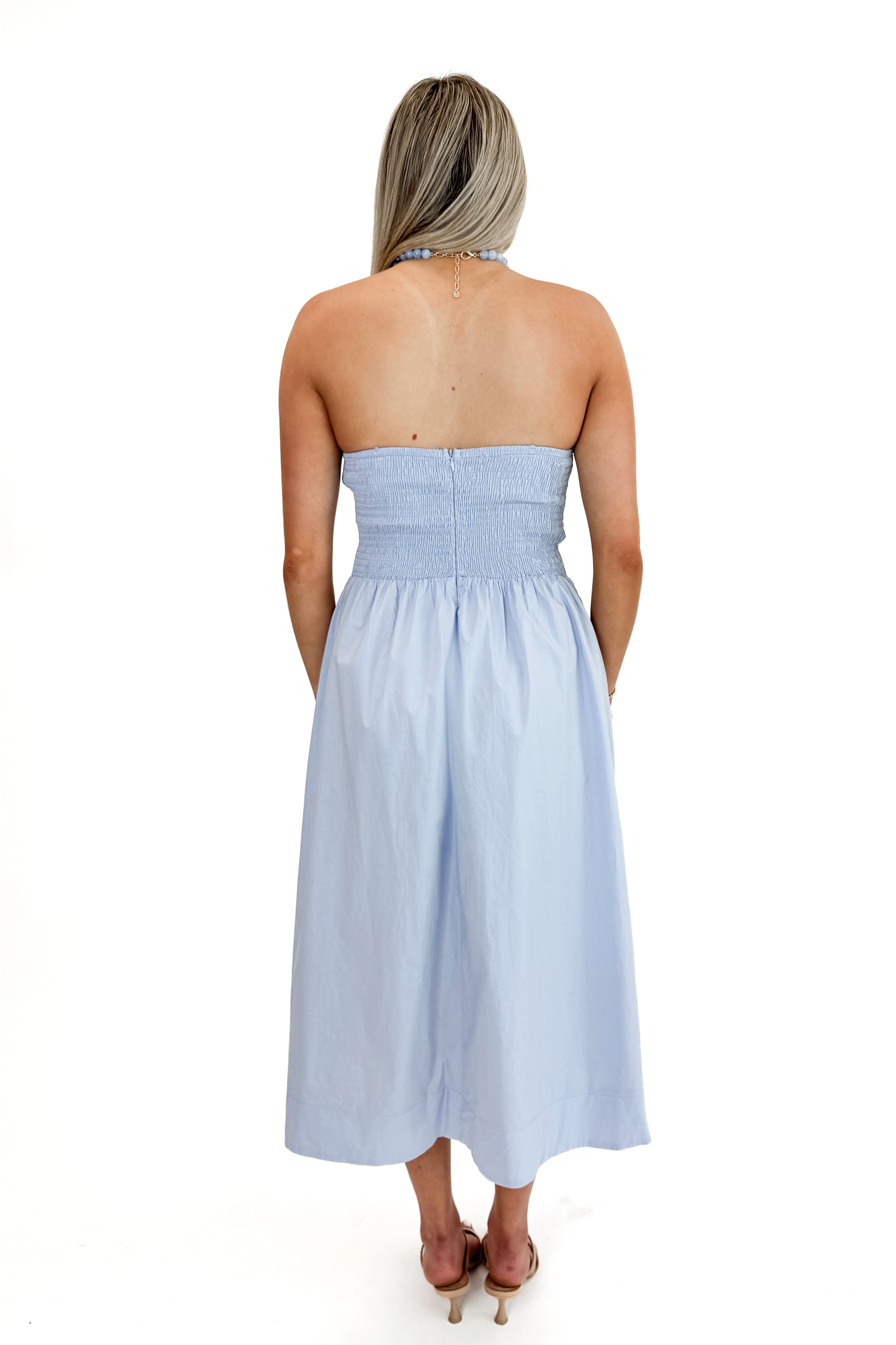 Back view of woman wearing Light Blue Pintucked Detail Midi Dress against white studio background.