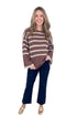 Studio picture of woman wearing Mocha & Brown Striped Sweater by She + Sky with white background.