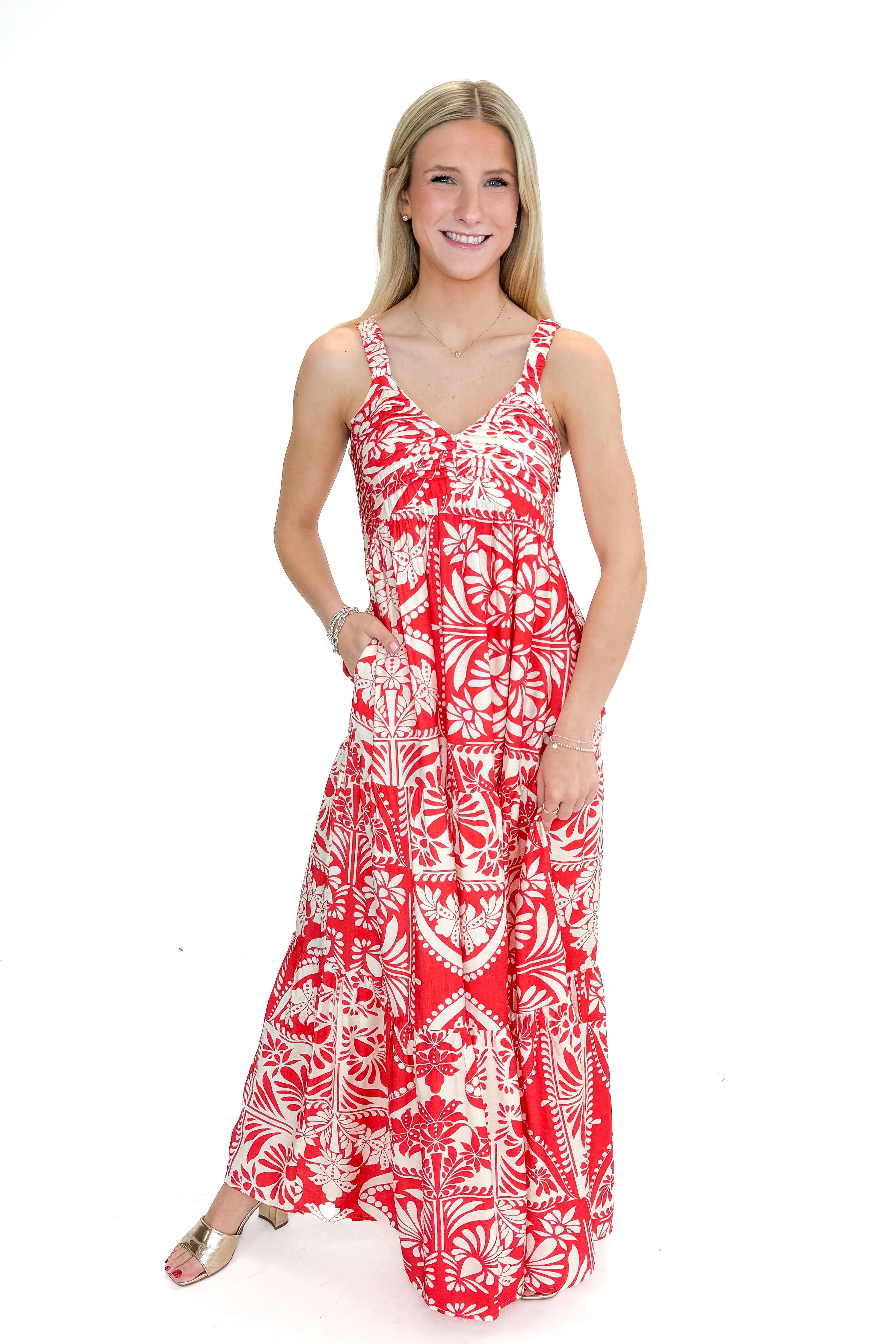 Front view of woman wearing Red Printed Sleeveless V-neck Maxi Dress against white studio background.