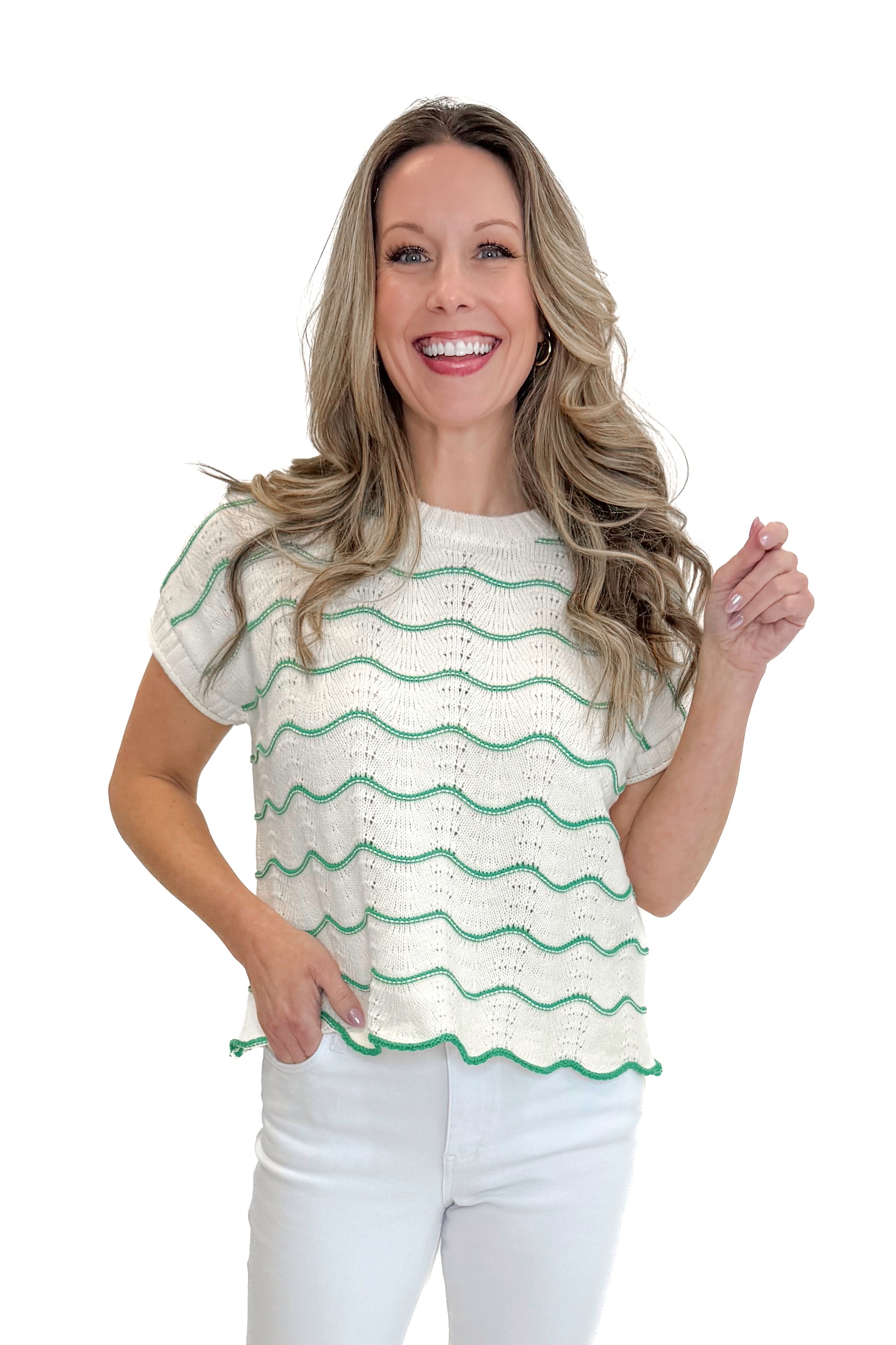 Front view of woman wearing Green & Cream Scallop Detail Short Sleeve Sweater with jeans against white studio background.