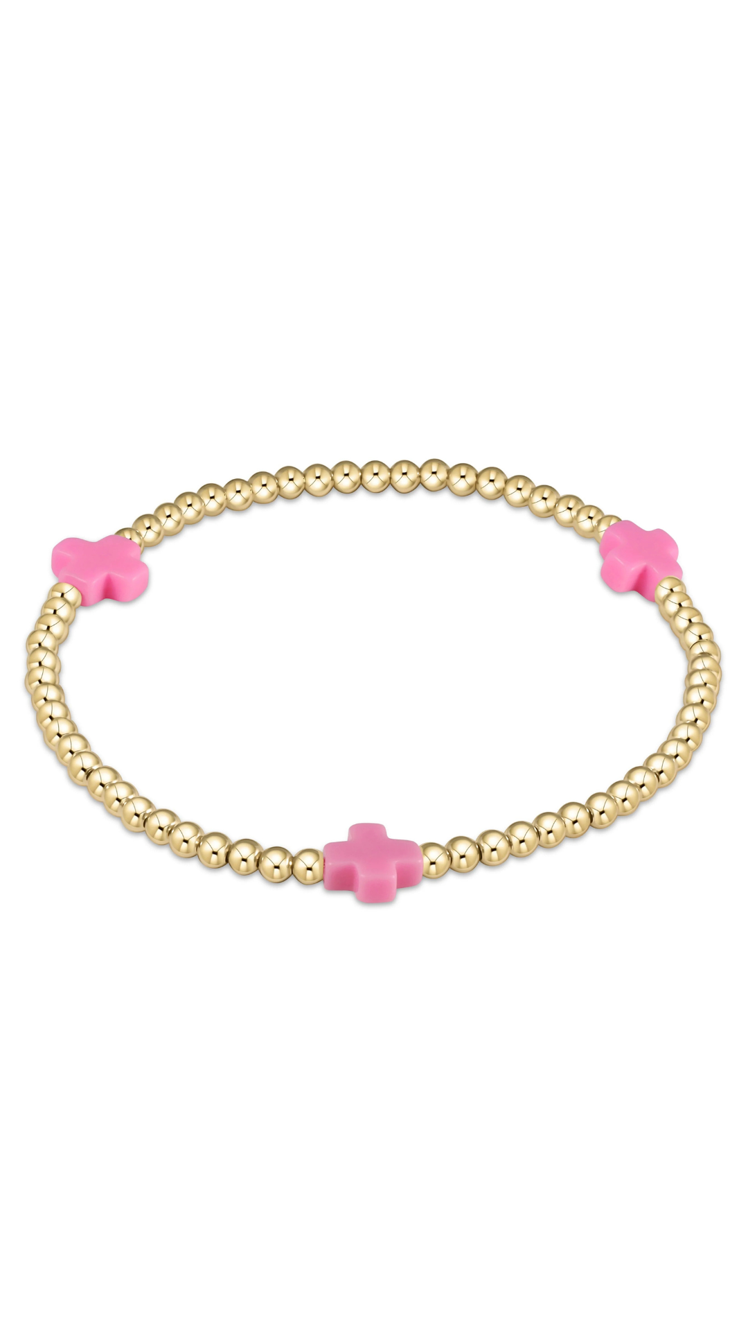 gold enewton bracelet with pink cross detailing on plain white background