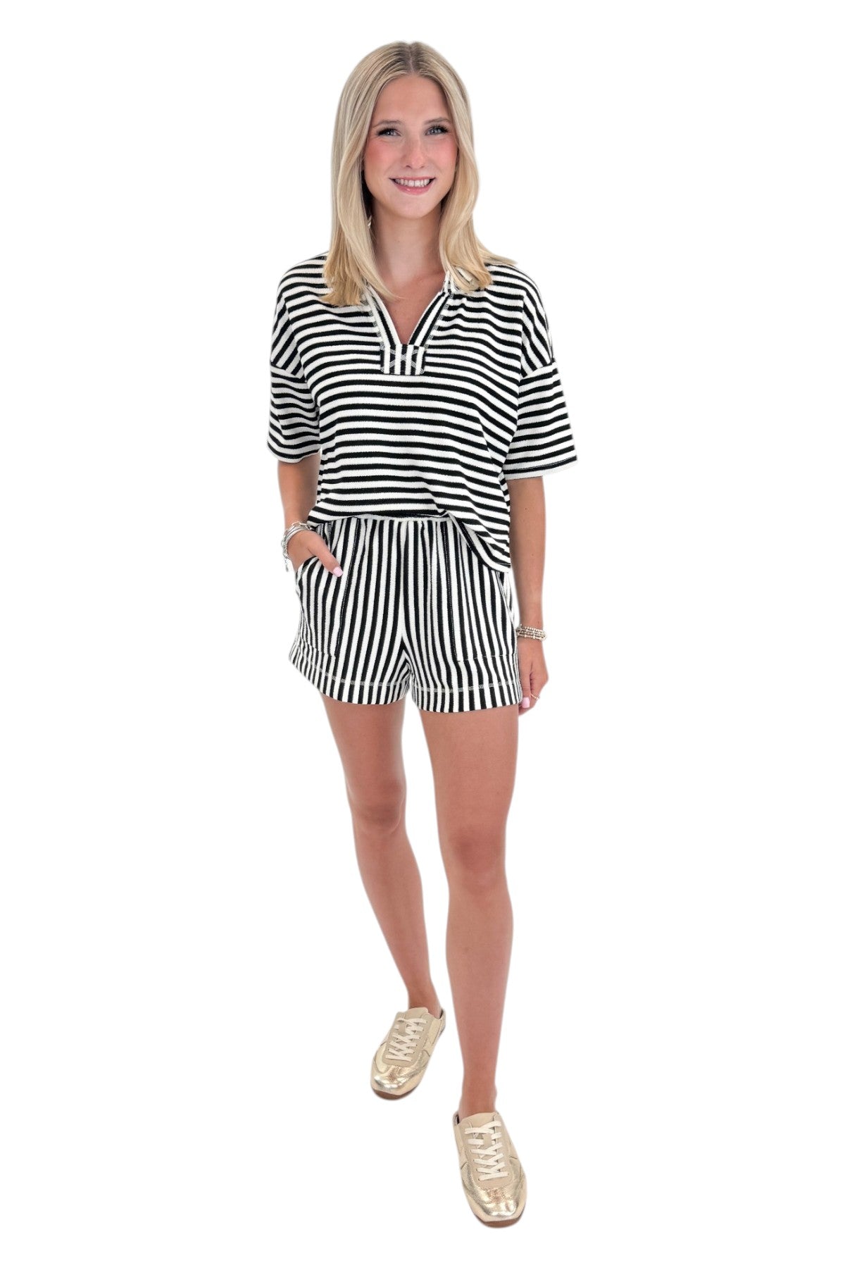 Front view of woman wearing Swagger Boutiqueβs Black & White Striped Lounge Shorts with matching shorts against white studio background.