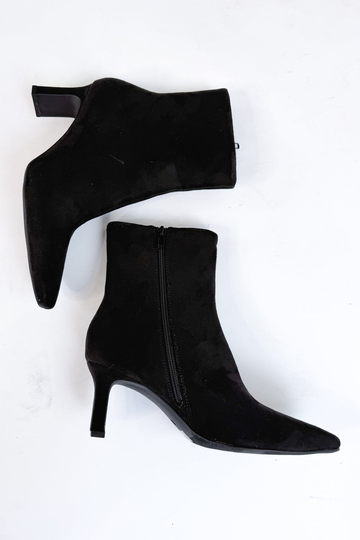 Swan- Black Suede Booties side view against white studio background.