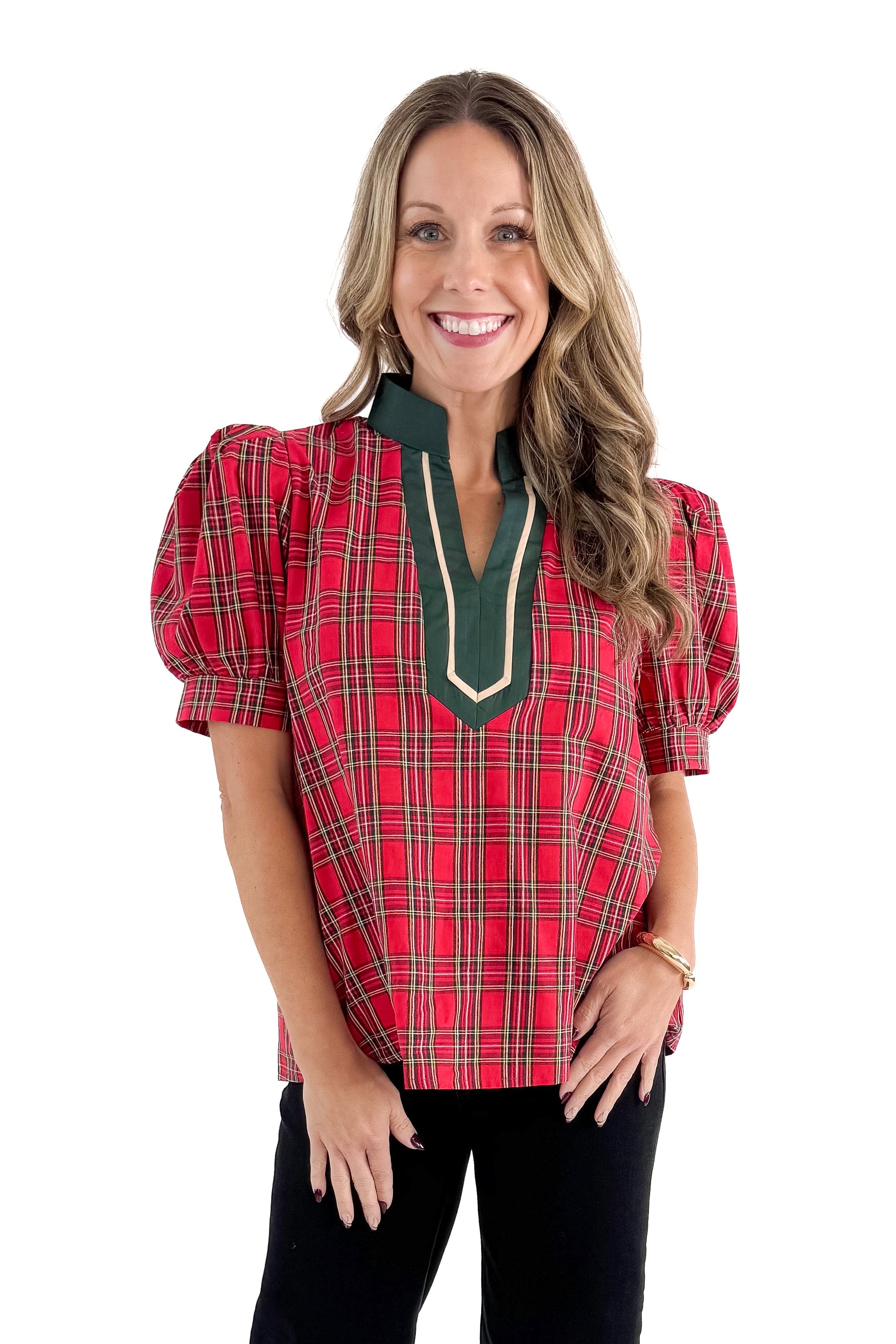 Front view of woman wearing Red Tartan With Green V-neck Detail Top with jeans against white studio background.