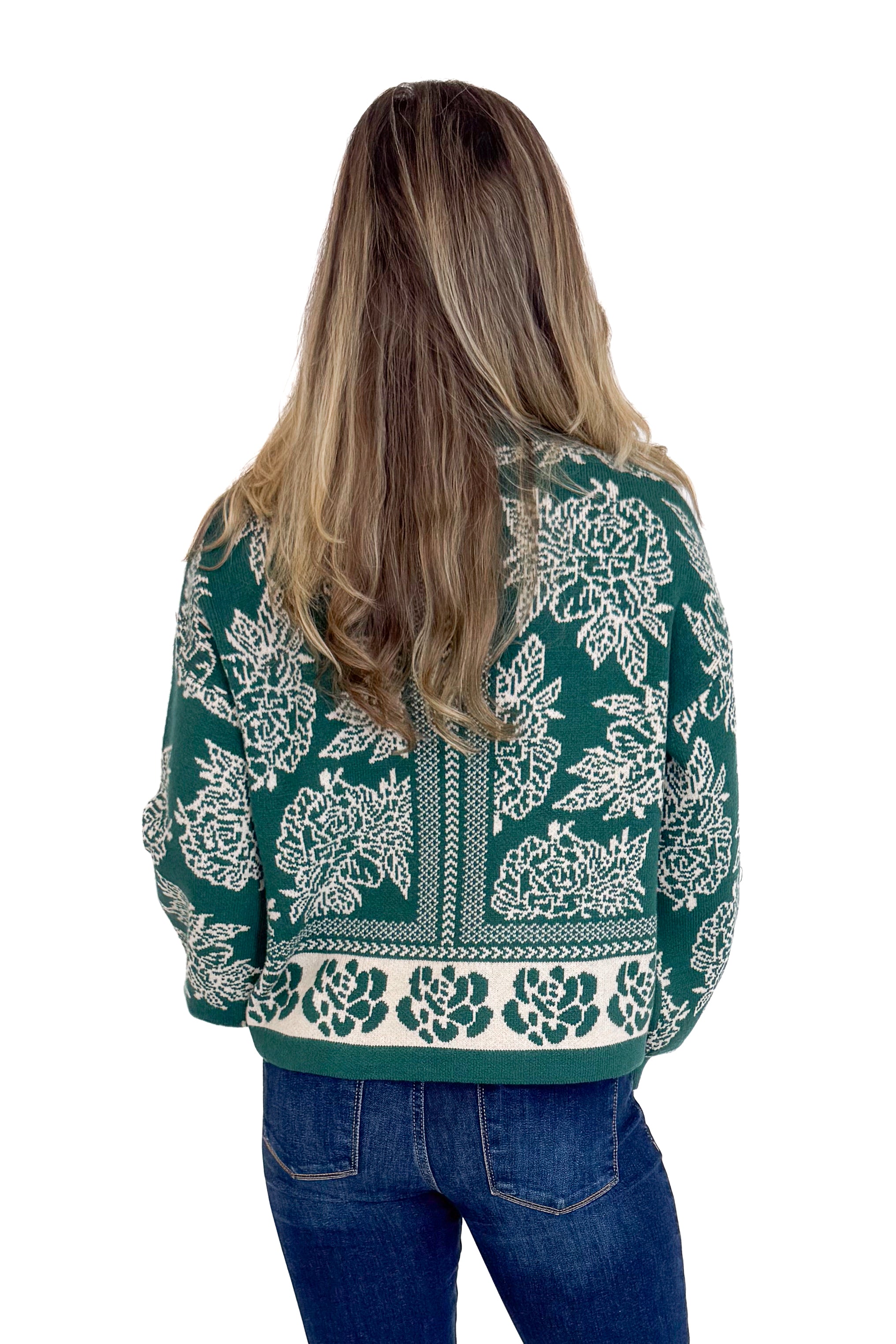Person wearing a green patterned jacket on a white background