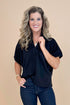 Front view of Black Collared V-neck Top by Entro and blue jeans.