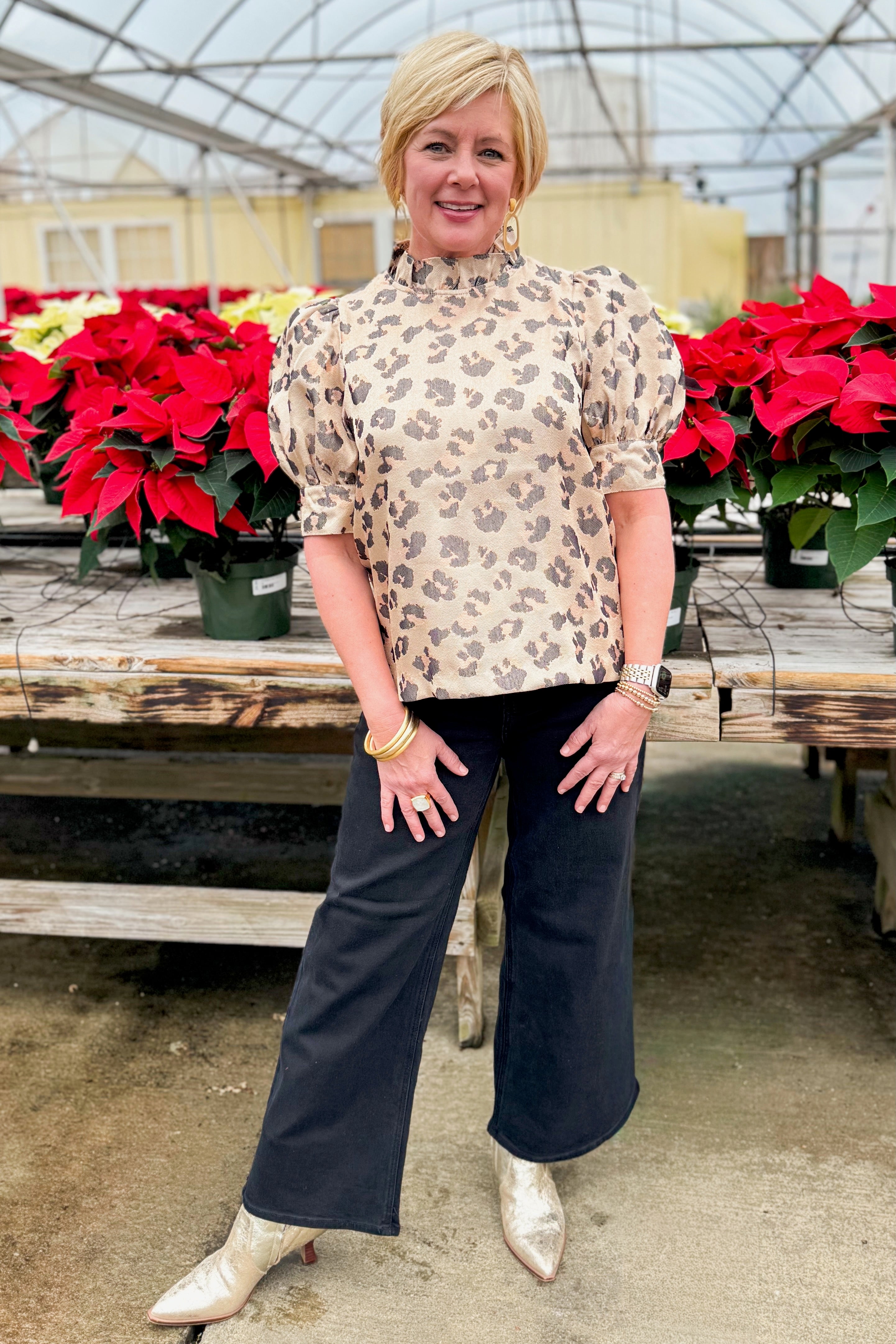 Front view of woman wearing Gold Leopard Print Top by Entro with jeans by holiday decor.
