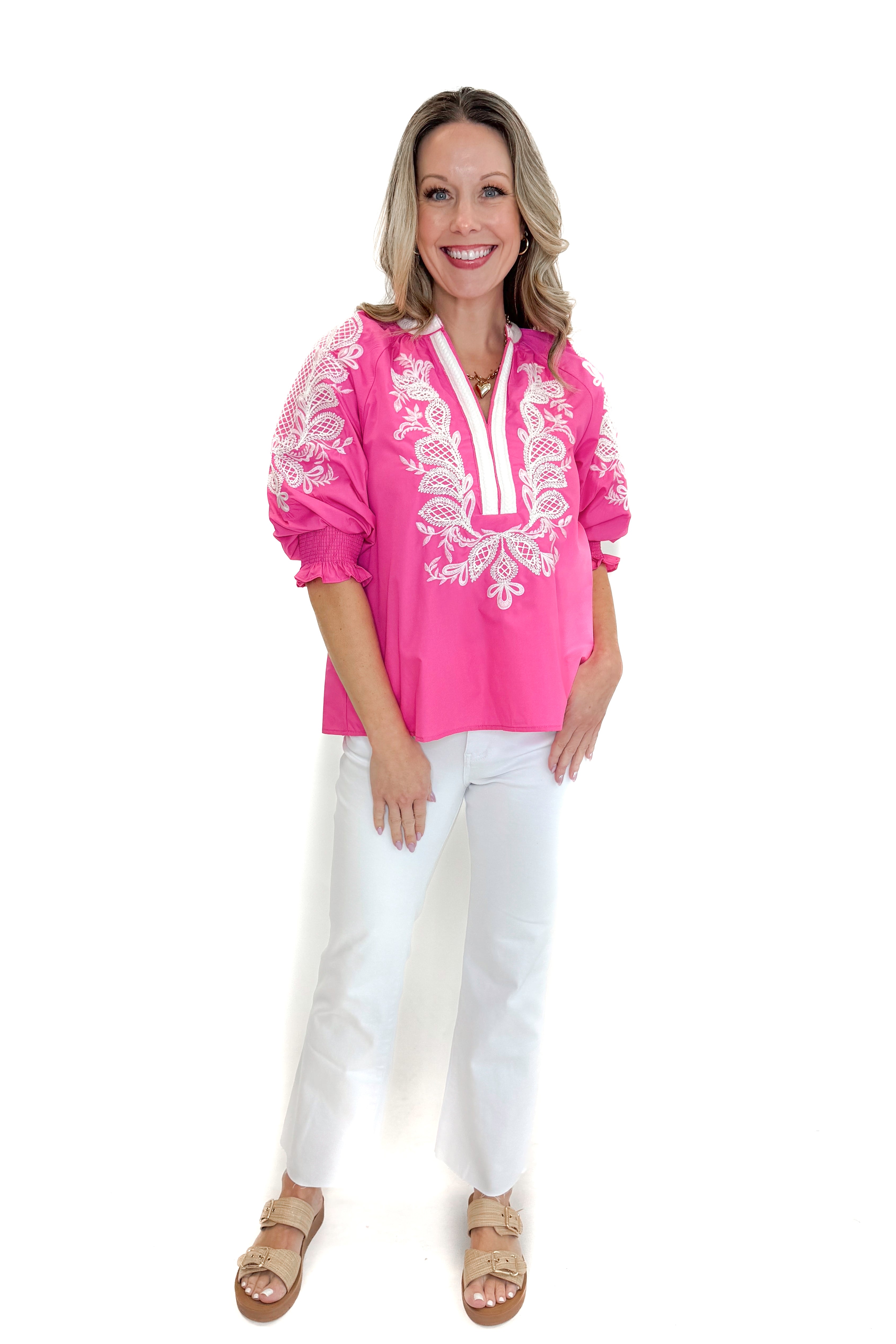 Front view of woman wearing Pink & White Embroidered 3/4 Sleeve Top by Entro with jeans against white studio background.