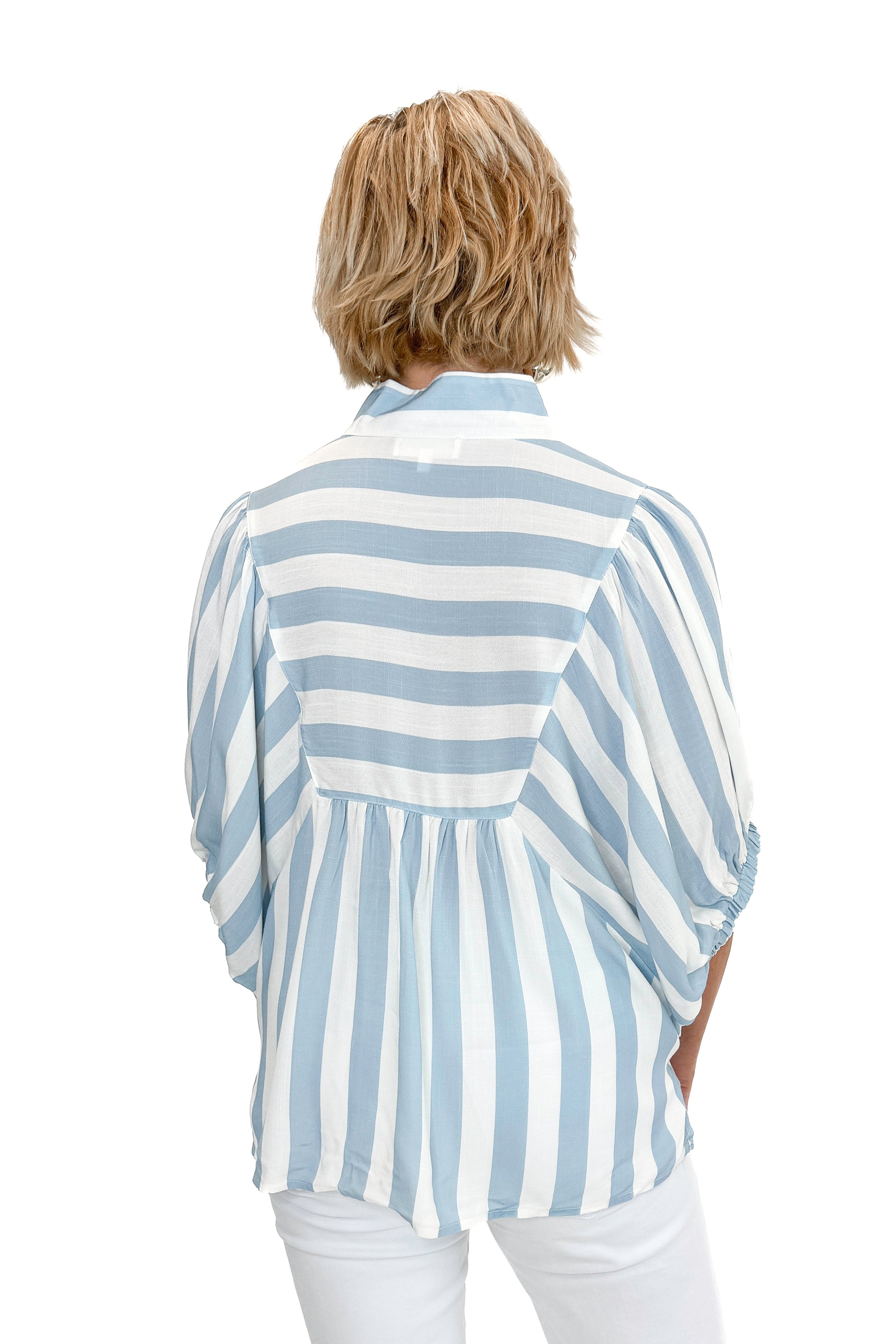 Back view of woman wearing Light Blue Stripe Detail V-Neck Top by Entro with jeans against white studio background.